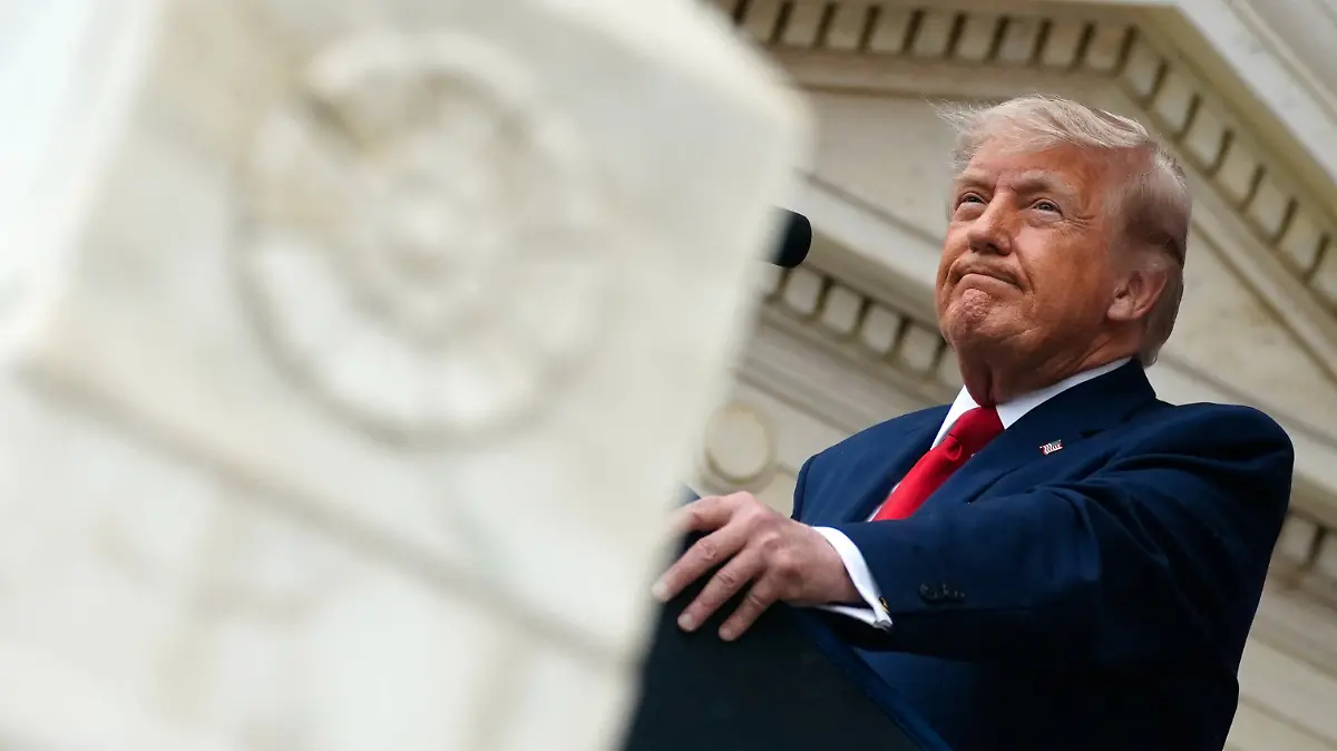U.S. President Donald Trump looks on as he delivers remarks in the Memorial Amphitheater during a Memorial Day event at Arlington National Cemetery, Arlington, Virginia, U.S., May 25, 2026. REUTERS/Nathan Howard