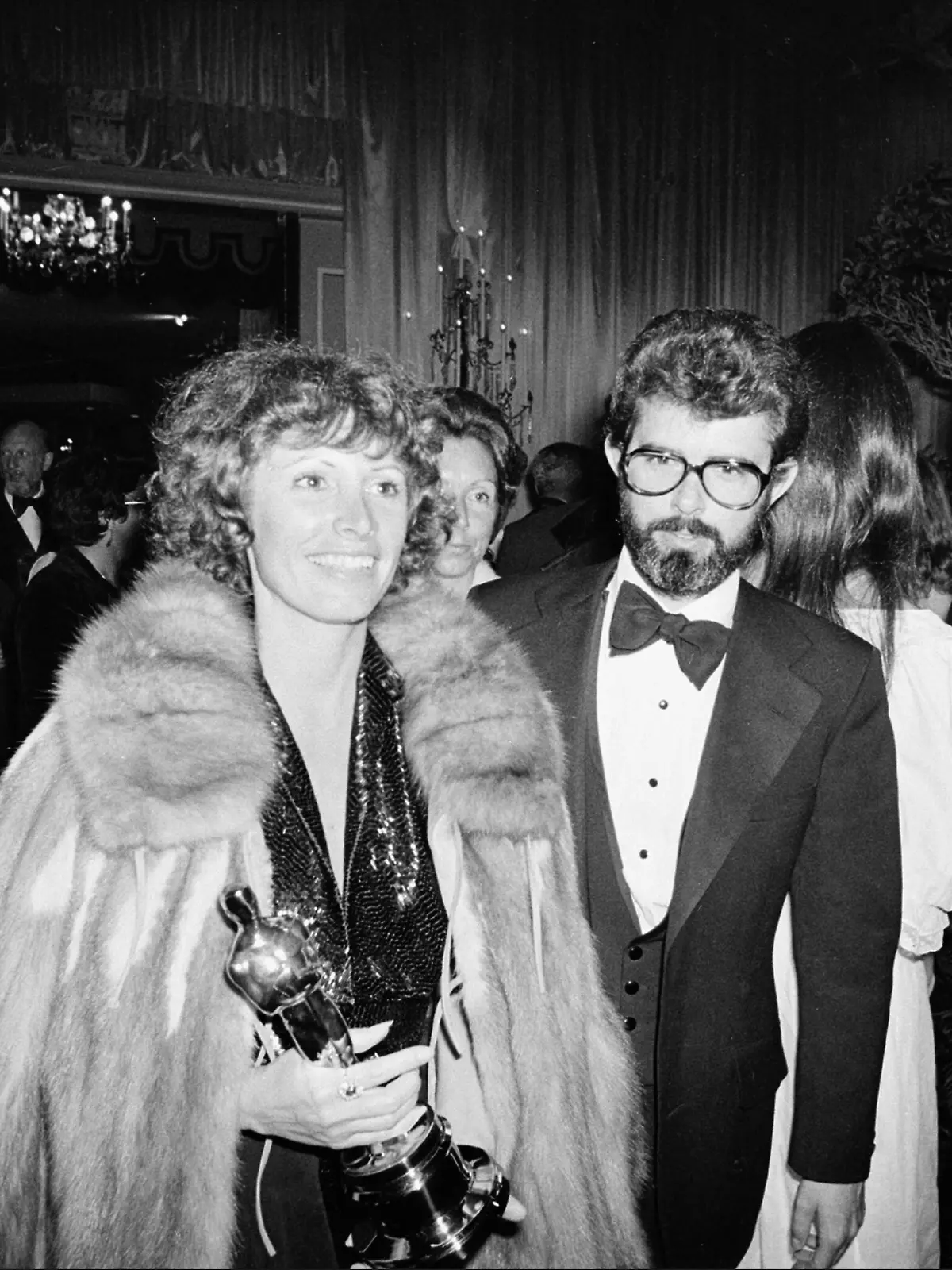 Marcia Lucas, wife of director George Lucas, right, carries her Oscar statuette as they arrive at a post Academy Awards party at the Beverly Hilton Hotel in Los Angeles, Ca., April 4, 1978. She won for best achievement in film editing for "Star Wars," directed by her husband. (AP Photo)