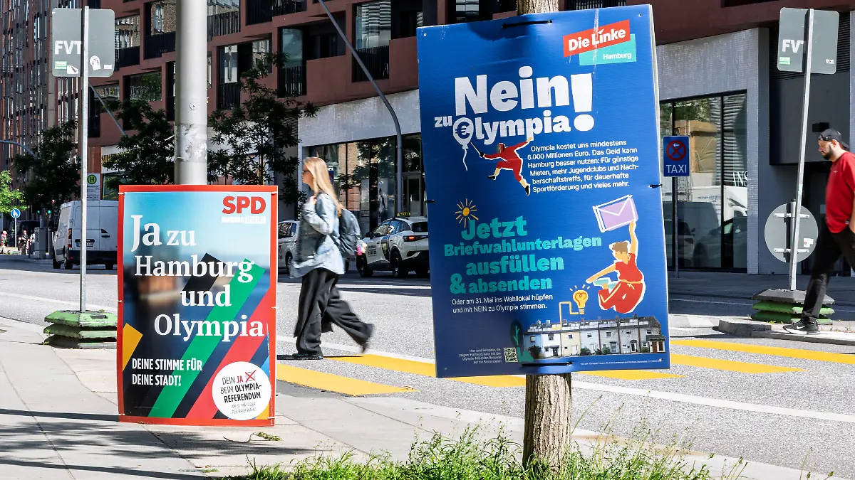 Zwei Plakate werben mit gegensätzlichen Positionen zur Olympia-Bewerbung, darunter «Ja zu Hamburg und Olympia» (SPD) und «Nein! zu Olympia» (Die Linke). In Hamburg läuft die Kampagne vor dem Referendum über eine mögliche Olympiabewerbung der Stadt. +++ dpa-Bildfunk +++