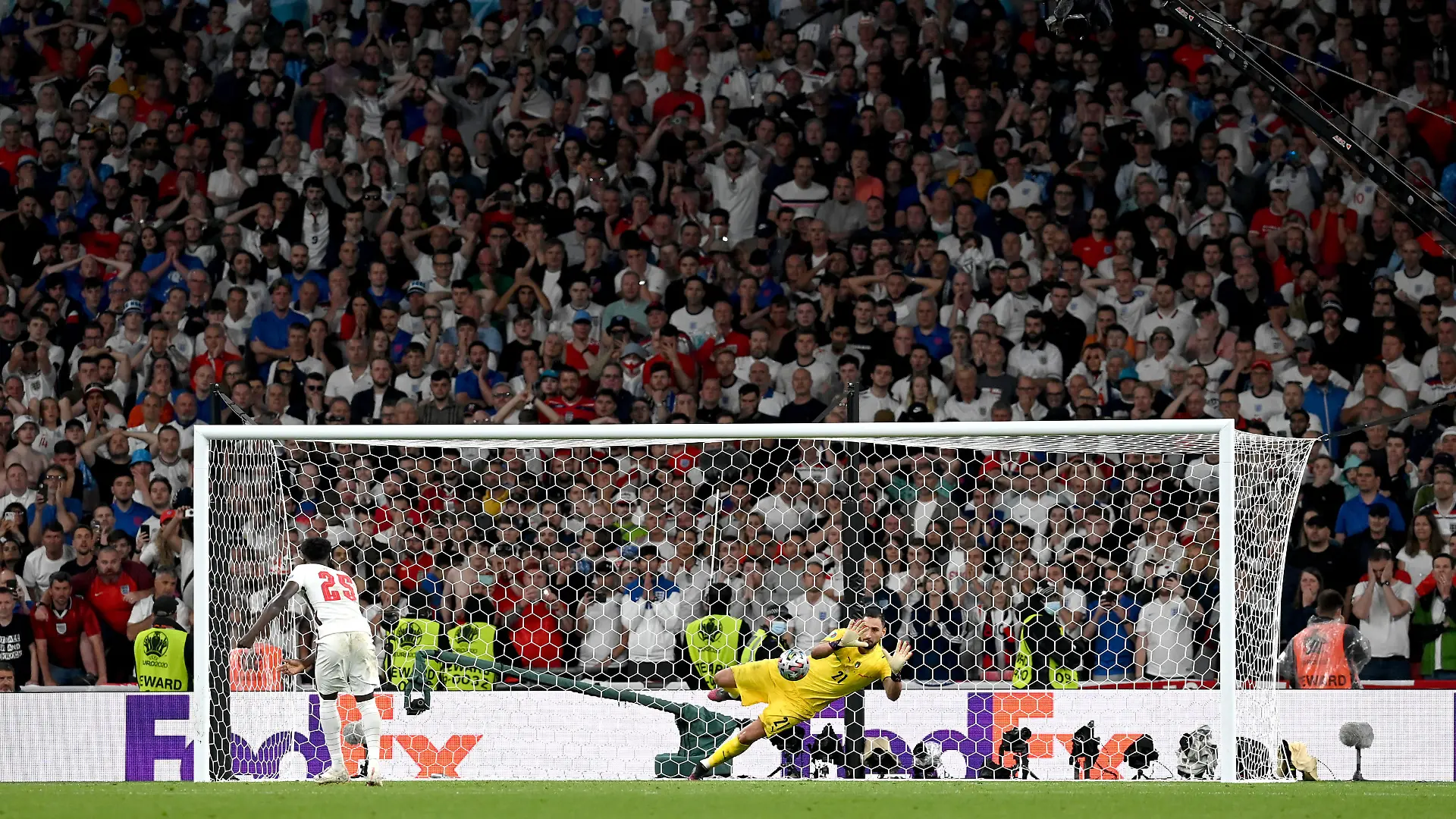 LONDON, ENGLAND - JULY 11: Bukayo Saka of England misses his team's fifth penalty in a penalty shoot out which is saved by Gianluigi Donnarumma of Italy during the penalty shoot out in the UEFA Euro 2020 Championship Final between Italy and England at Wembley Stadium on July 11, 2021 in London, England. (Photo by Paul Ellis - Pool/Getty Images)