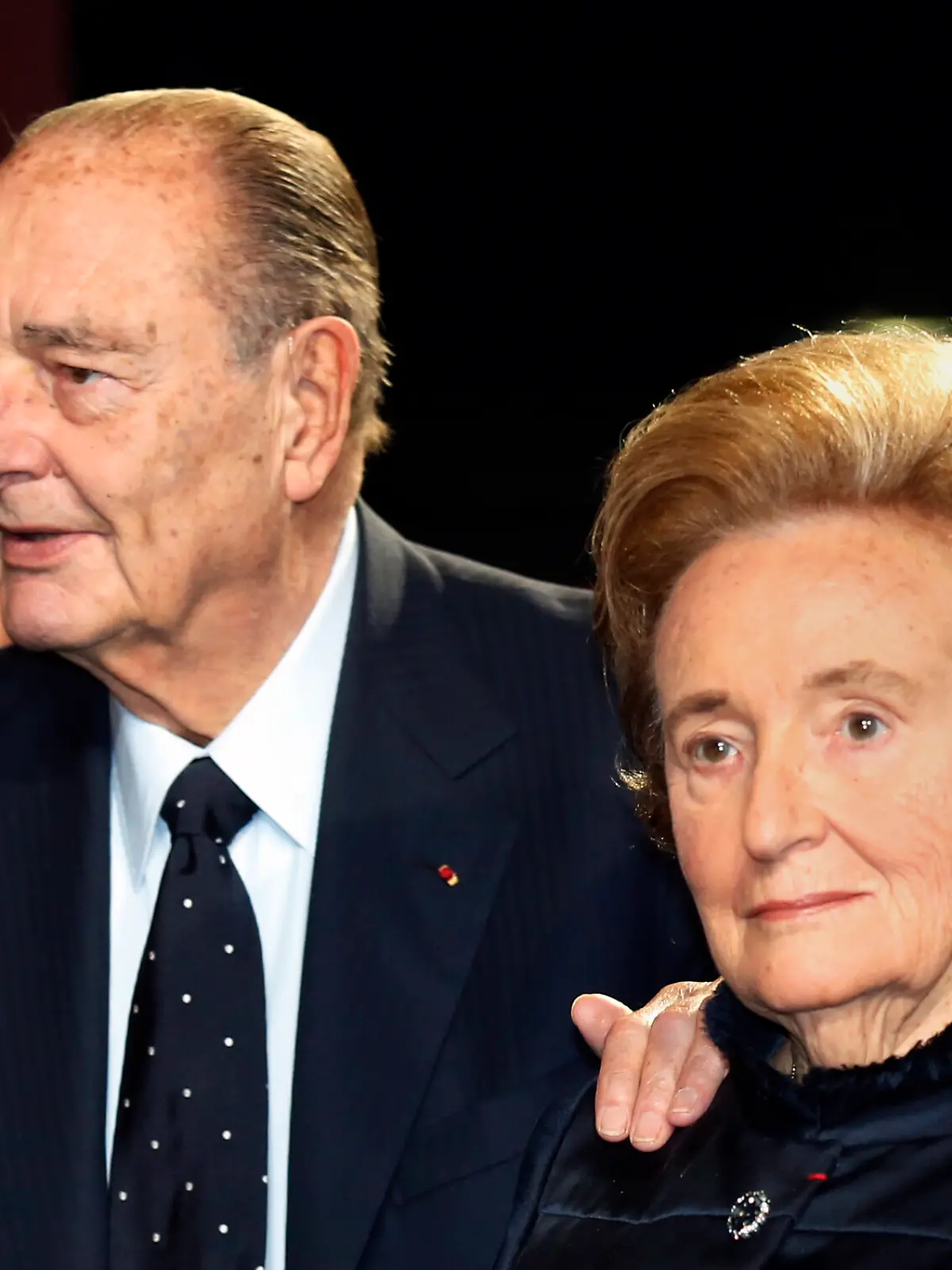 FILE - In this Nov. 21, 2013 file photo, former French President Jacques Chirac and his wife Bernadette arrive to attend an award ceremony in Paris. France's former President Jacques Chirac is supplanting U.S. President John Fitzgerald Kennedy in a street of the French town of Brive-la-Gaillarde in central France. (AP Photo/Jacky Naegelen, Pool, File)