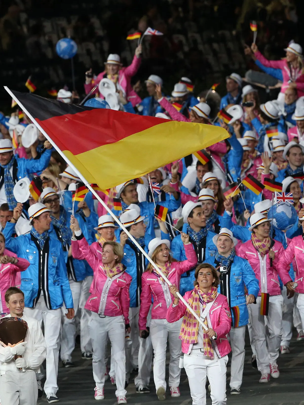 Germany's flag bearer Natascha Keller (front) leads the team into the stadium during the Opening Ceremony of the London 2012 Olympic Games, London, Britain, 27 July 2012. The 2012 Summer Olympic Games will be held in London from 27 July to 12 August 2012. Photo: Michael Kappeler dpa  +++(c) dpa - Bildfunk+++