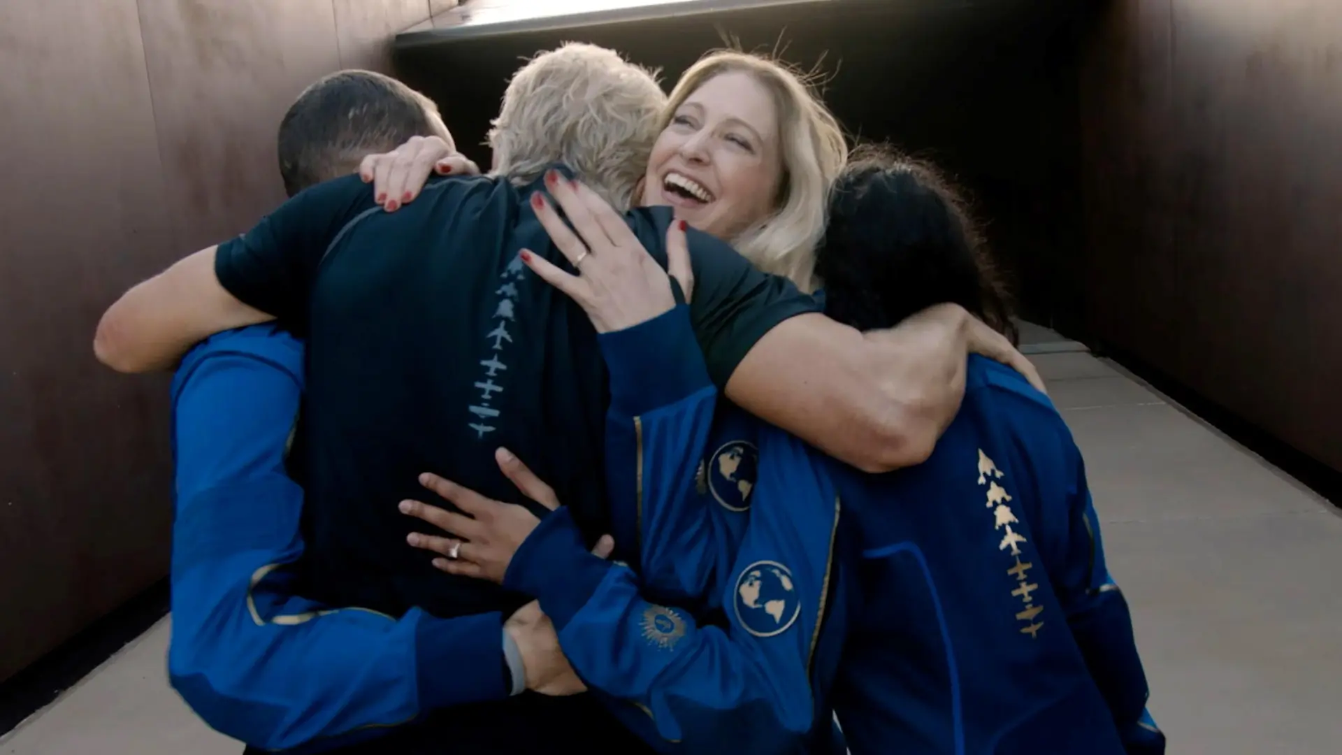 Virgin Galactic's chief astronaut instructor Beth Moses embraces Richard Branson and other crew as he arrives to board the company's passenger rocket plane VSS Unity at Spaceport America near Truth or Consequences, New Mexico, U.S. July 11, 2021 in a still image from video. Virgin Galactic/Handout via REUTERS. NO RESALES. NO ARCHIVES. THIS IMAGE HAS BEEN SUPPLIED BY A THIRD PARTY.
