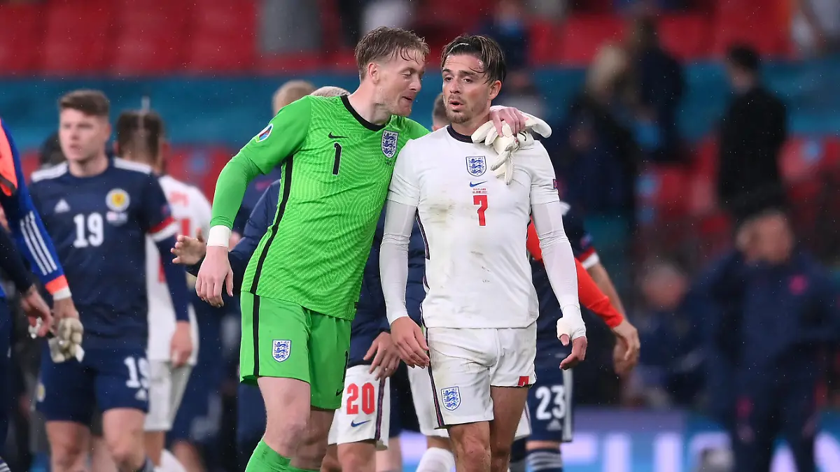 LONDON, ENGLAND - JUNE 18: Jordan Pickford of England interacts with team mate Jack Grealish after the UEFA Euro 2020 Championship Group D match between England and Scotland at Wembley Stadium on June 18, 2021 in London, England. (Photo by Laurence Griffiths/Getty Images)