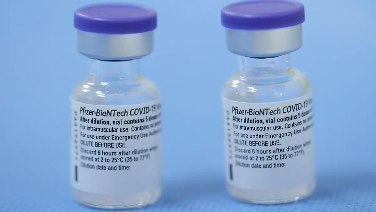 FILE PHOTO: Vials of the Pfizer-BioNTech vaccine are pictured in a vaccination centre in Geneva, Switzerland, February 3, 2021.      REUTERS/Denis Balibouse//File Photo