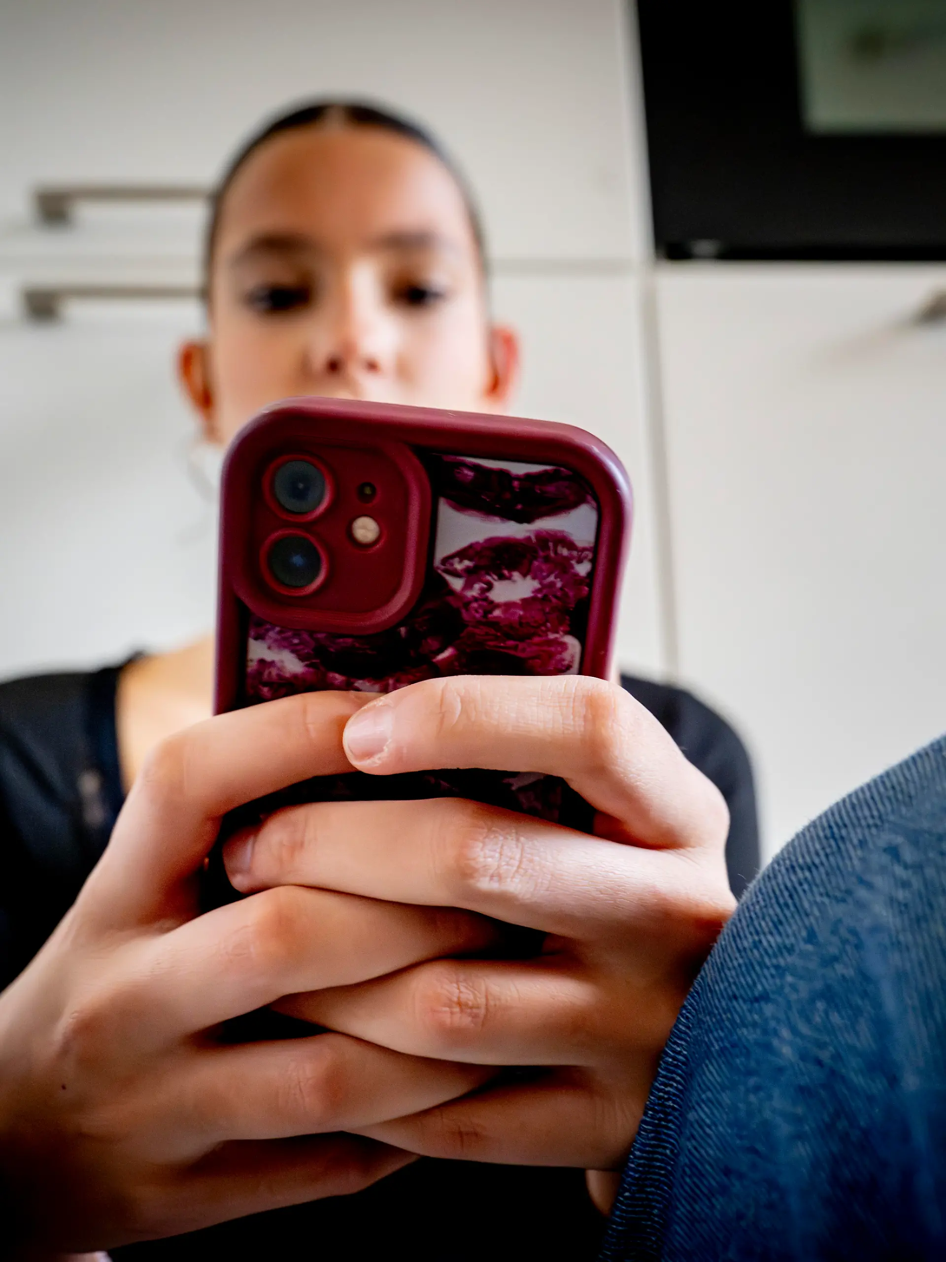 ILLUSTRATIVE - A teenage girl on her mobile phone. A 2014 Maastricht University study found that 70% of young people under 21 are addicted to their mobile phones. More than 1,400 doctors, scientists, and experts are calling on politicians to establish age limits for smartphone and social media use. ROBIN UTRECHT
