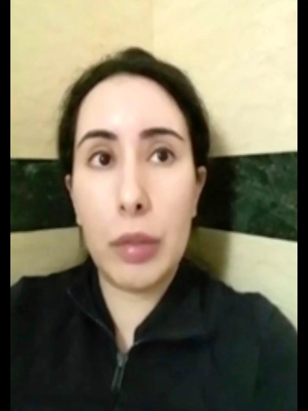 FILE - This undated file image taken from video in an unknown location shows Sheikha Latifa bint Mohammed Al Maktoum speaking into a mobile phone camera. Sheikha Latifa, who has been the subject of concern from a United Nations panel after being seized trying to flee the sheikhdom in 2018, appeared in a social media post Monday, June 21, 2021, that described her as being in Spain on a "European holiday." (#FreeLatifa campaign – Tiina Jauhiainen/David Haigh via AP, File)