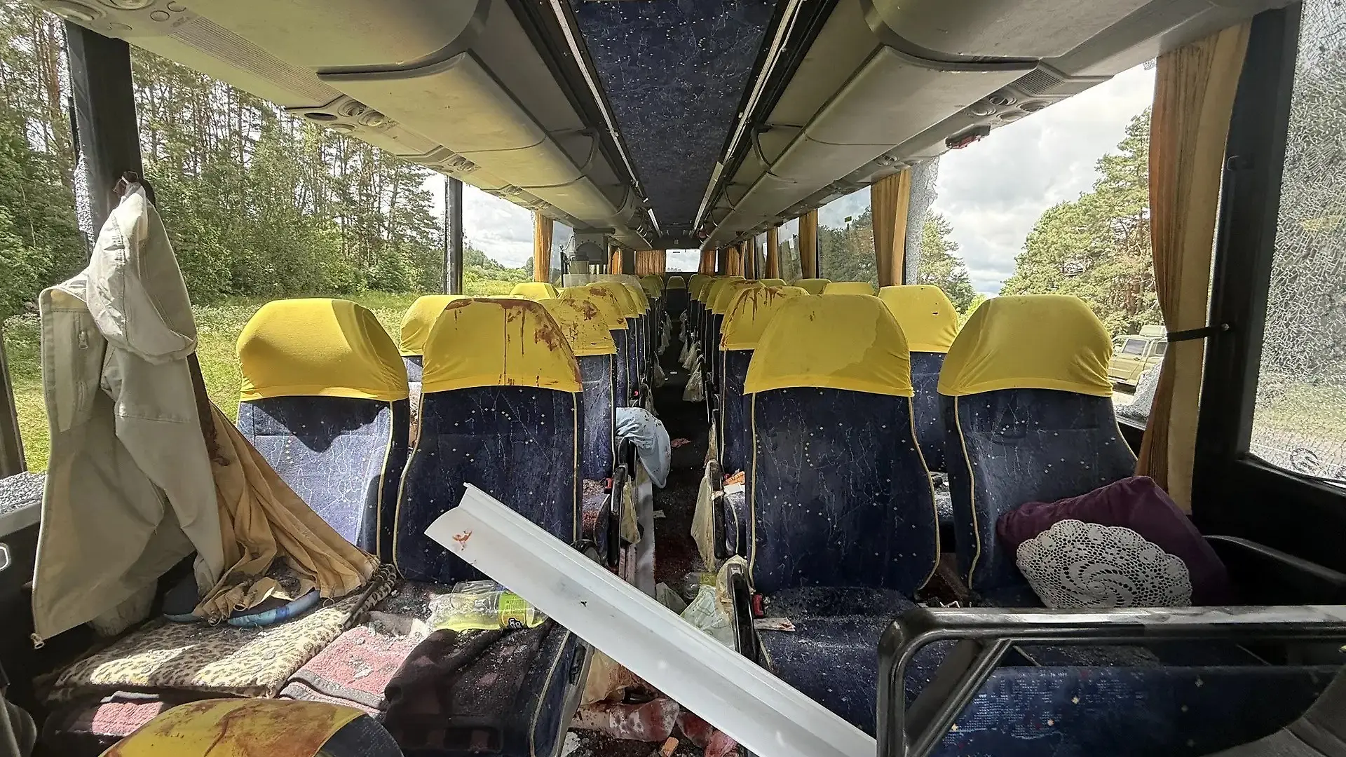 This handout picture posted on the official Telegram channel of Yegor Kovalchuk, acting governor of the Bryansk region, on June 17, 2026 shows the site of a drone strike on a bus at a highway in the Bryansk region. A Ukrainian drone hit a bus carrying a children's football team from Belarus in Russia's border Bryansk region, local authorities said on June 17, 2026. The strike killed a woman who accompanied the team and wounded six people, among them four children, said Bryansk region acting governor Yegor Kovalchuk. (Photo by Handout / Telegram / @E_V_Kovalchuk / AFP) / RESTRICTED TO EDITORIAL USE - MANDATORY CREDIT "AFP PHOTO / Telegram / @E_V_Kovalchuk" - HANDOUT - NO MARKETING NO ADVERTISING CAMPAIGNS - DISTRIBUTED AS A SERVICE TO CLIENTS