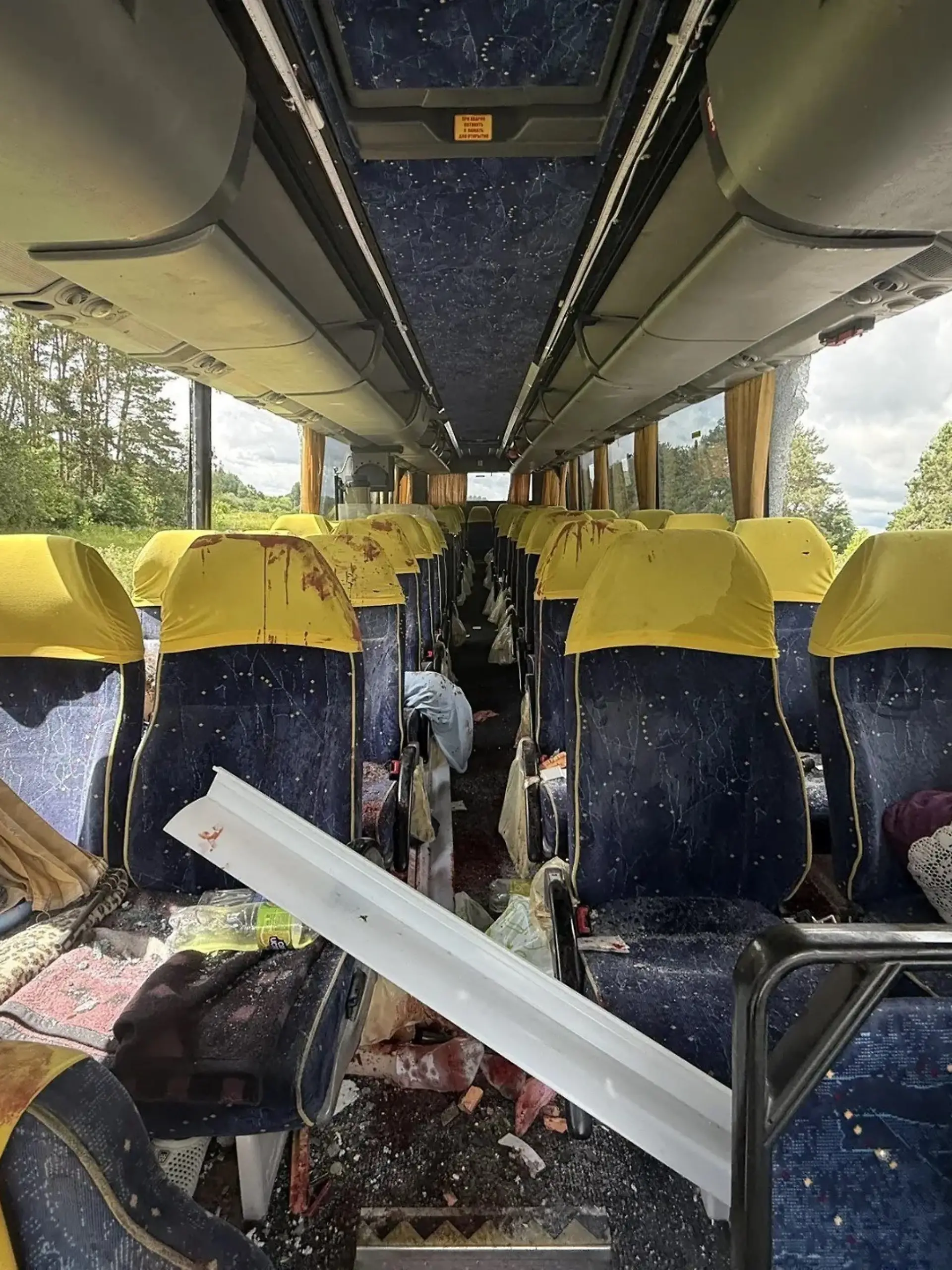 This handout picture posted on the official Telegram channel of Yegor Kovalchuk, acting governor of the Bryansk region, on June 17, 2026 shows the site of a drone strike on a bus at a highway in the Bryansk region. A Ukrainian drone hit a bus carrying a children's football team from Belarus in Russia's border Bryansk region, local authorities said on June 17, 2026. The strike killed a woman who accompanied the team and wounded six people, among them four children, said Bryansk region acting governor Yegor Kovalchuk. (Photo by Handout / Telegram / @E_V_Kovalchuk / AFP) / RESTRICTED TO EDITORIAL USE - MANDATORY CREDIT "AFP PHOTO / Telegram / @E_V_Kovalchuk" - HANDOUT - NO MARKETING NO ADVERTISING CAMPAIGNS - DISTRIBUTED AS A SERVICE TO CLIENTS