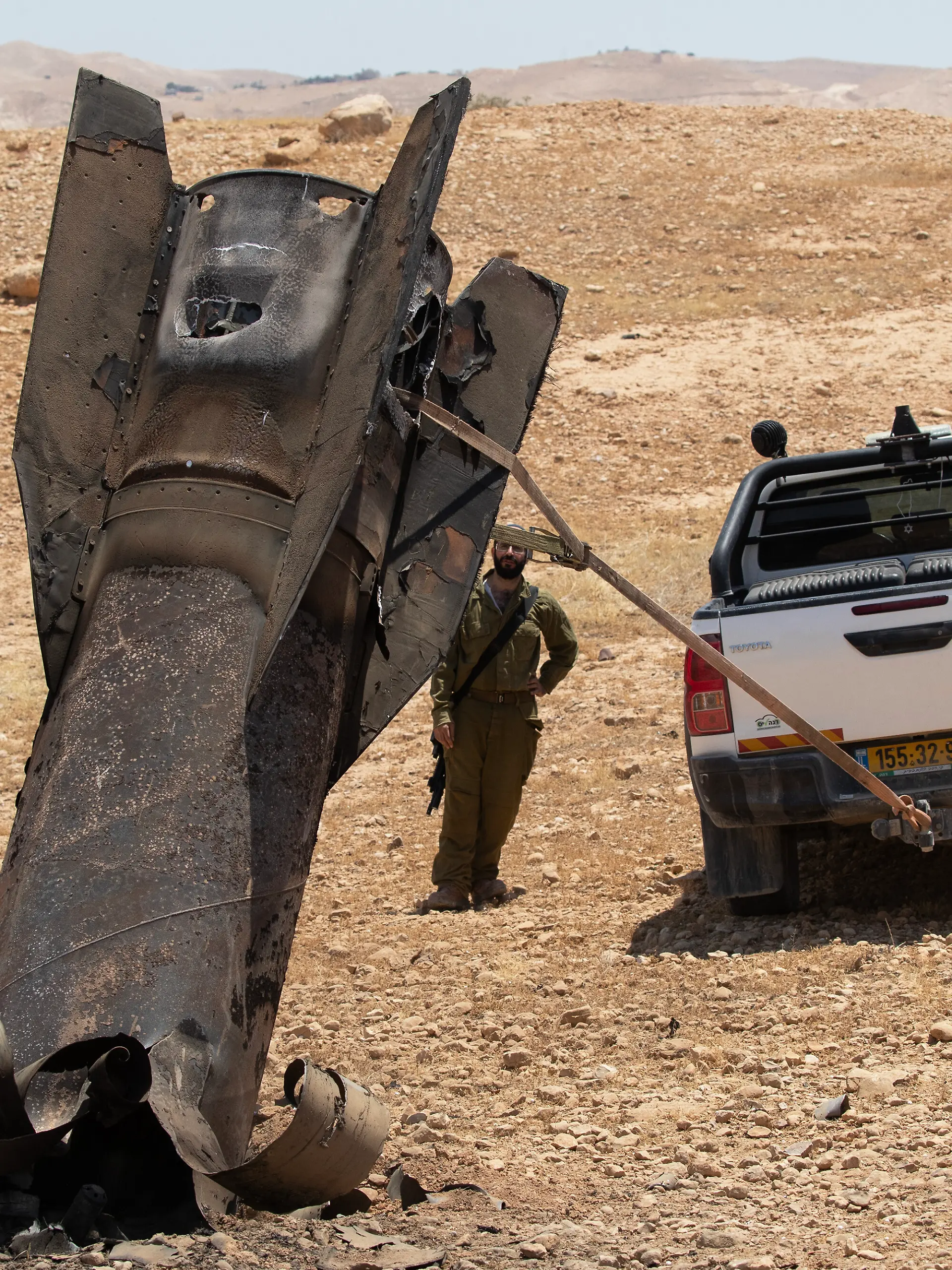 An Israeli soldier watches as they begin to remove an Iranian ballistic missile sticking out from the desert landscape in the area near Jericho, in the West Bank on Monday, June 8, 2026 after it was intercepted by Israel and fell to the desert. Iran fired barrages of missiles and Israel carried out military strikes on both Beirut and Iran. Both Iran and Israel have signaled they would wind down the military escalation that shattered the two month ceasefire. Photo by Jim Hollander/UPI Photo via Newscom picture alliance