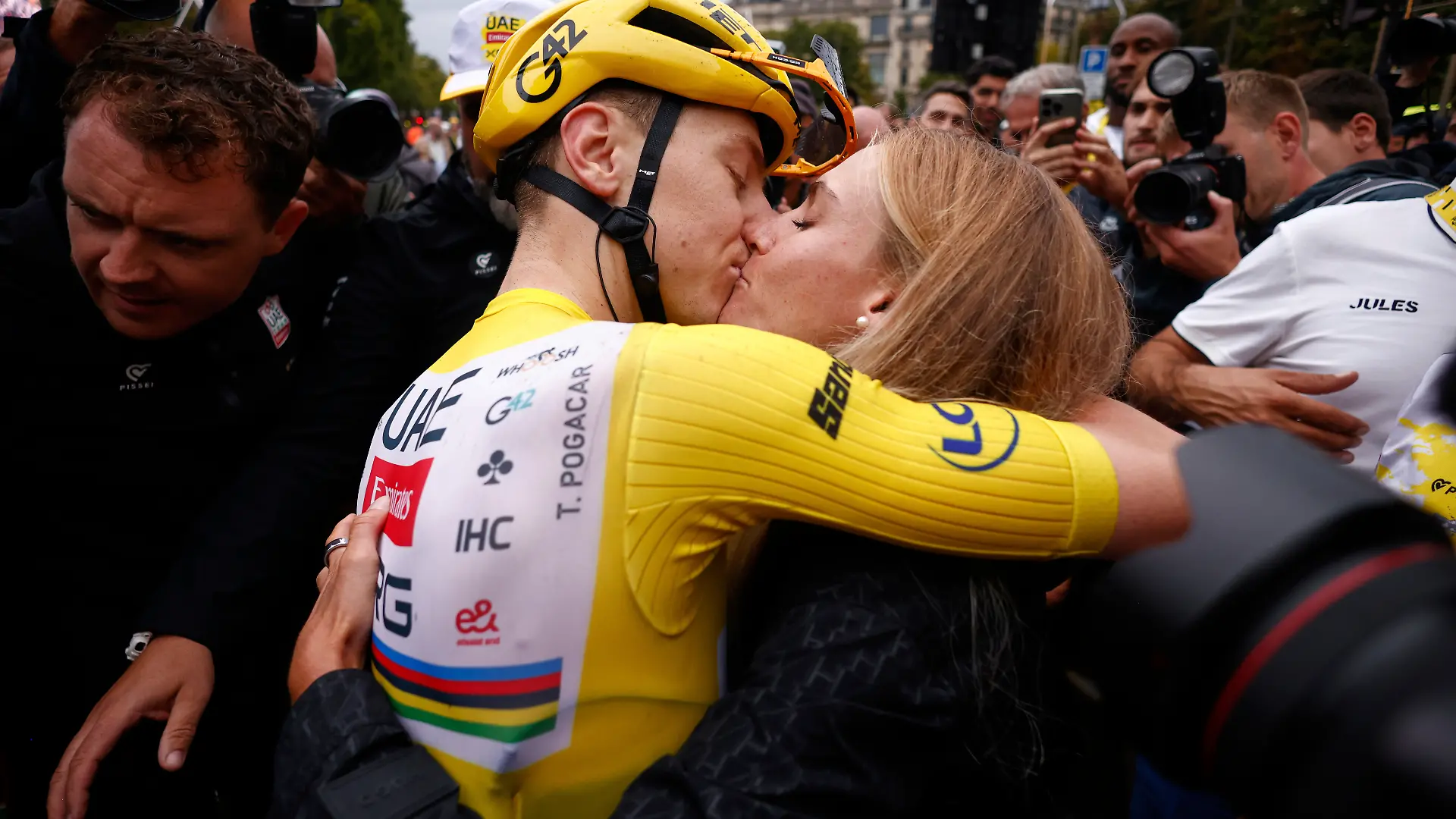 Slovenia's Tadej Pogacar, the Tour de France winner, is greeted by his partner Urska Zigart after finishing, the twenty-first stage of the Tour de France cycling race over 132.3 kilometers (82.1 miles) with start in Mantes-la-Ville and finish on the Champs-Elysees in Paris, France, Sunday, July 27, 2025. (Yoan Valat, Pool Photo via AP)