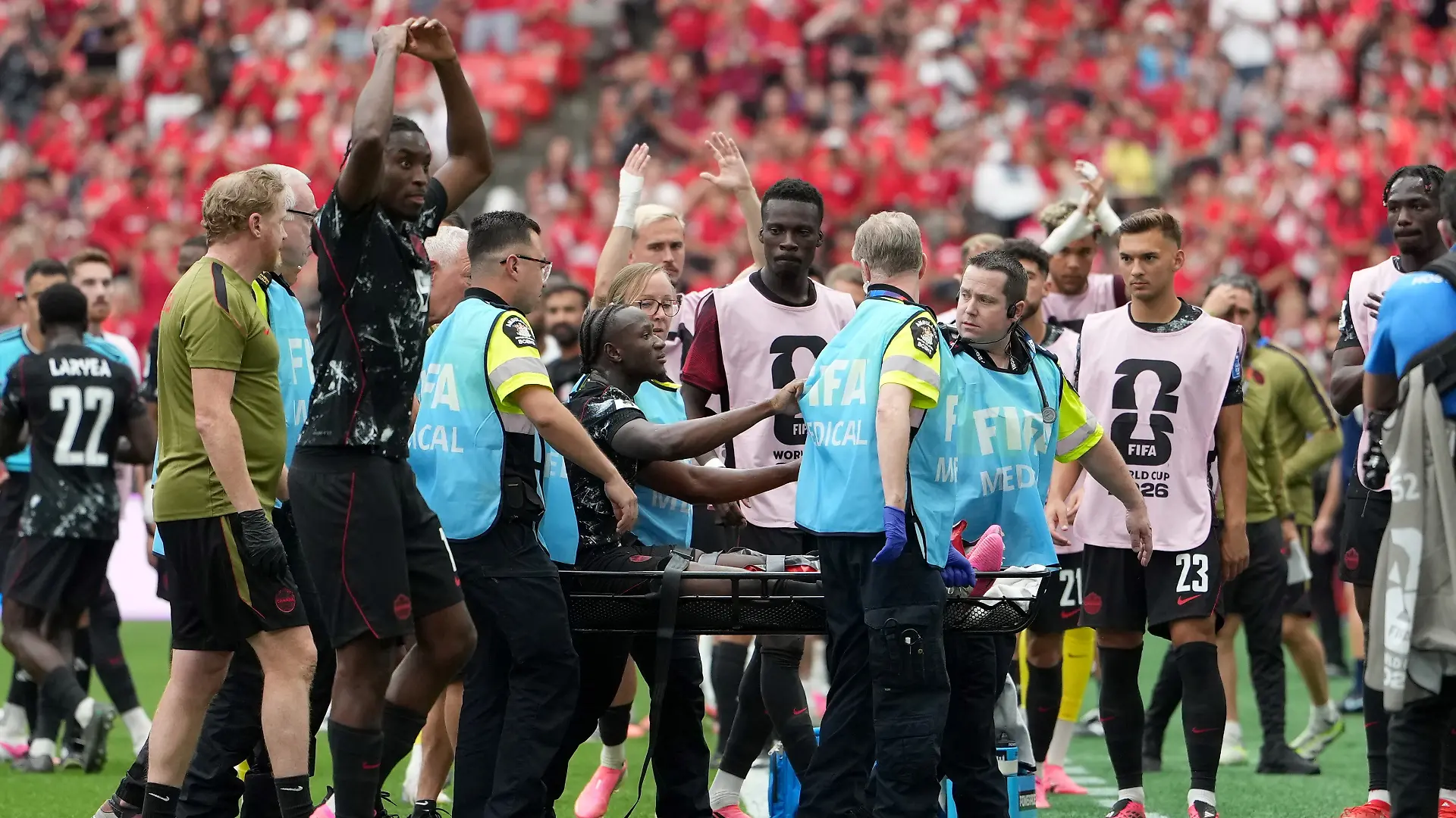 June 18, 2026, Vancouver, Bc, CANADA: Canada s Ismael Kone (8) is taken off the field by medical staff after he was apparently injured on a play during second half World Cup Group B soccer action against Qatar, in Vancouver, Thursday, June 18, 2026. (Credit Image: Ethan Cairns/The Canadian Press via ZUMA Press)