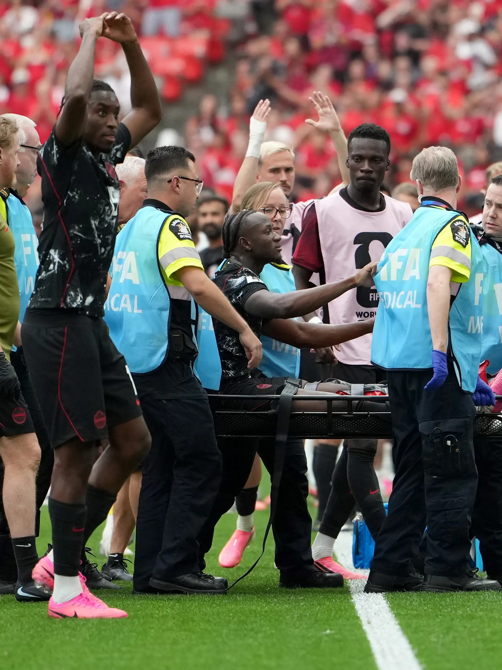 June 18, 2026, Vancouver, Bc, CANADA: Canada s Ismael Kone (8) is taken off the field by medical staff after he was apparently injured on a play during second half World Cup Group B soccer action against Qatar, in Vancouver, Thursday, June 18, 2026. (Credit Image: Ethan Cairns/The Canadian Press via ZUMA Press)