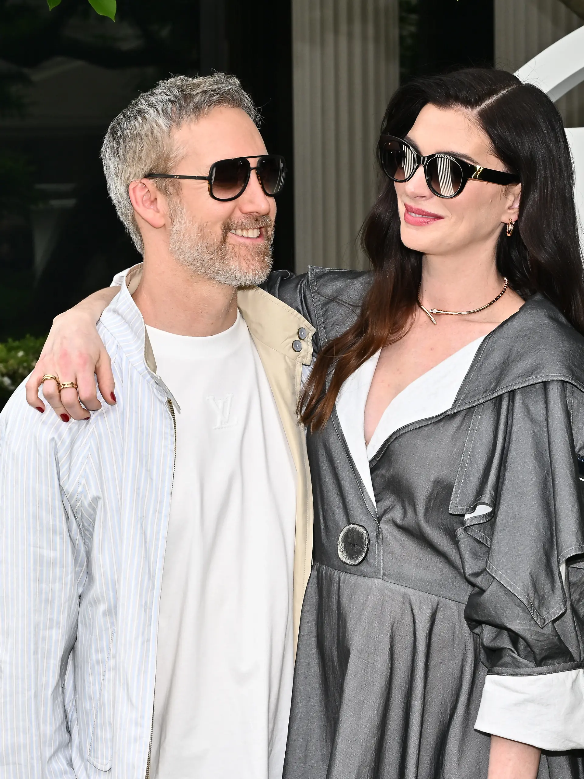Adam Shulman, left, and Anne Hathaway attend the Louis Vuitton Cruise 2027 Collection fashion show at The Frick Collection on Wednesday, May 20, 2026, in New York. (Photo by Evan Agostini/Invision/AP)