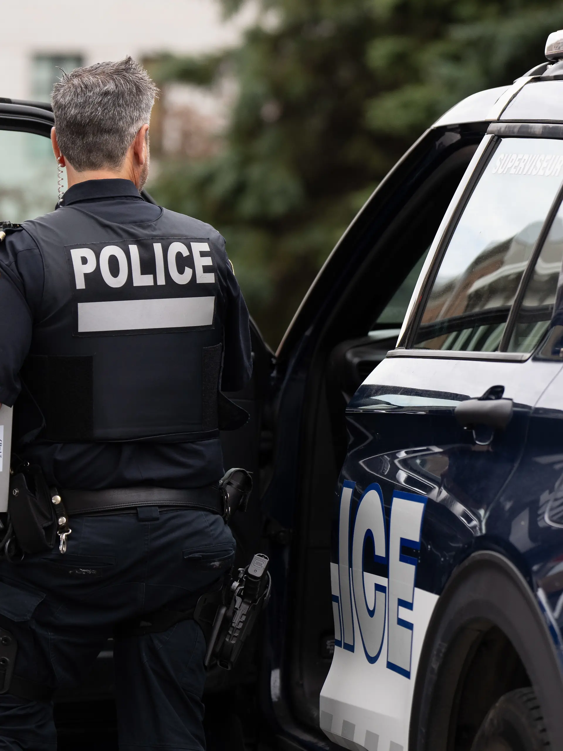 October 8, 2024, Montreal, Pq, CANADA: An SPVM police officer gets out of his patrol car in Montreal, Tuesday, Oct. 8, 2024. (Credit Image: © Christinne Muschi/The Canadian Press via ZUMA Press