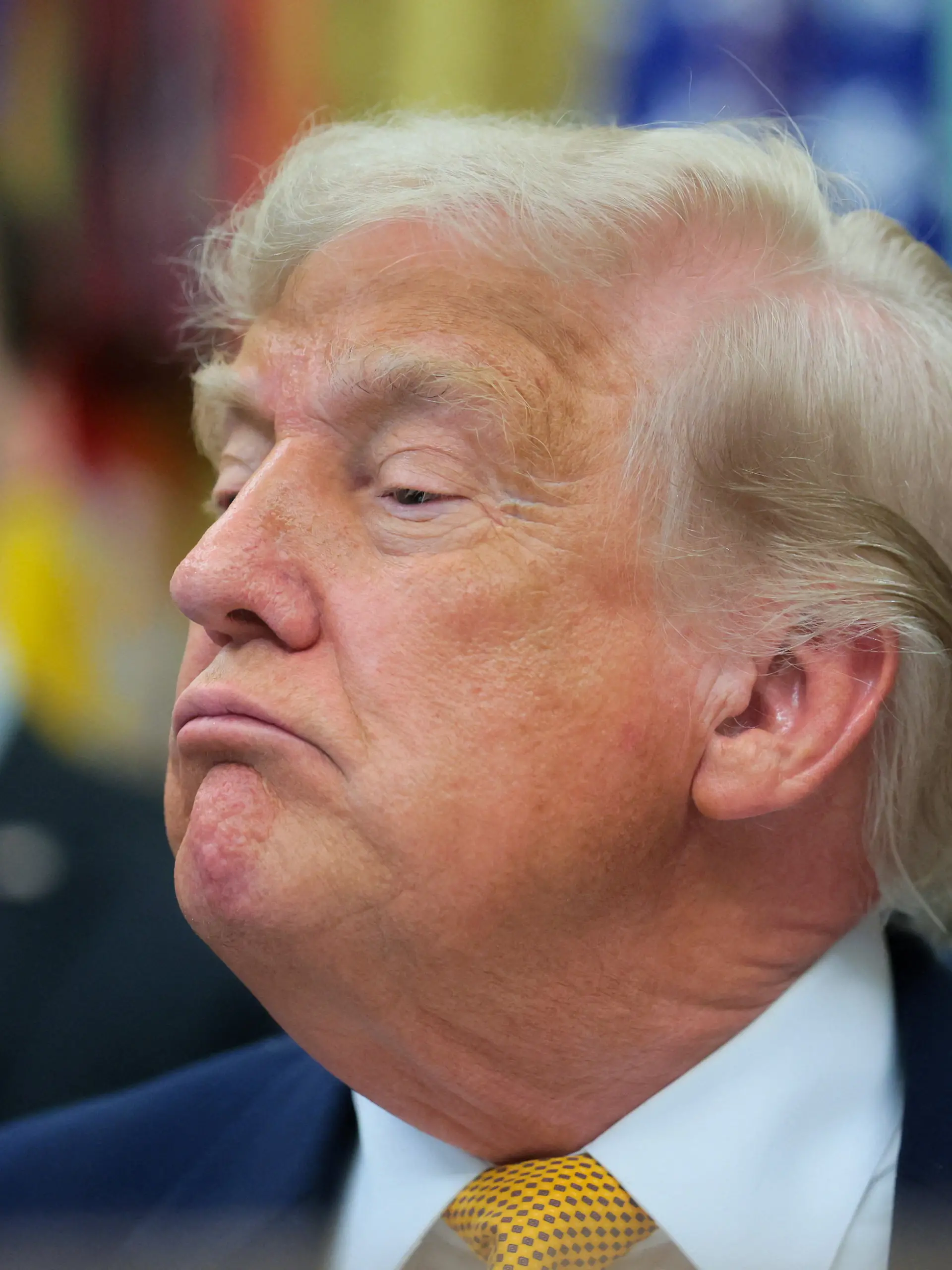 U.S. President Donald Trump looks on as he speaks to reporters before signing two executive orders regarding quantum computing, in the Oval Office at the White House in Washington, D.C., U.S., June 22, 2026. REUTERS/Jonathan Ernst