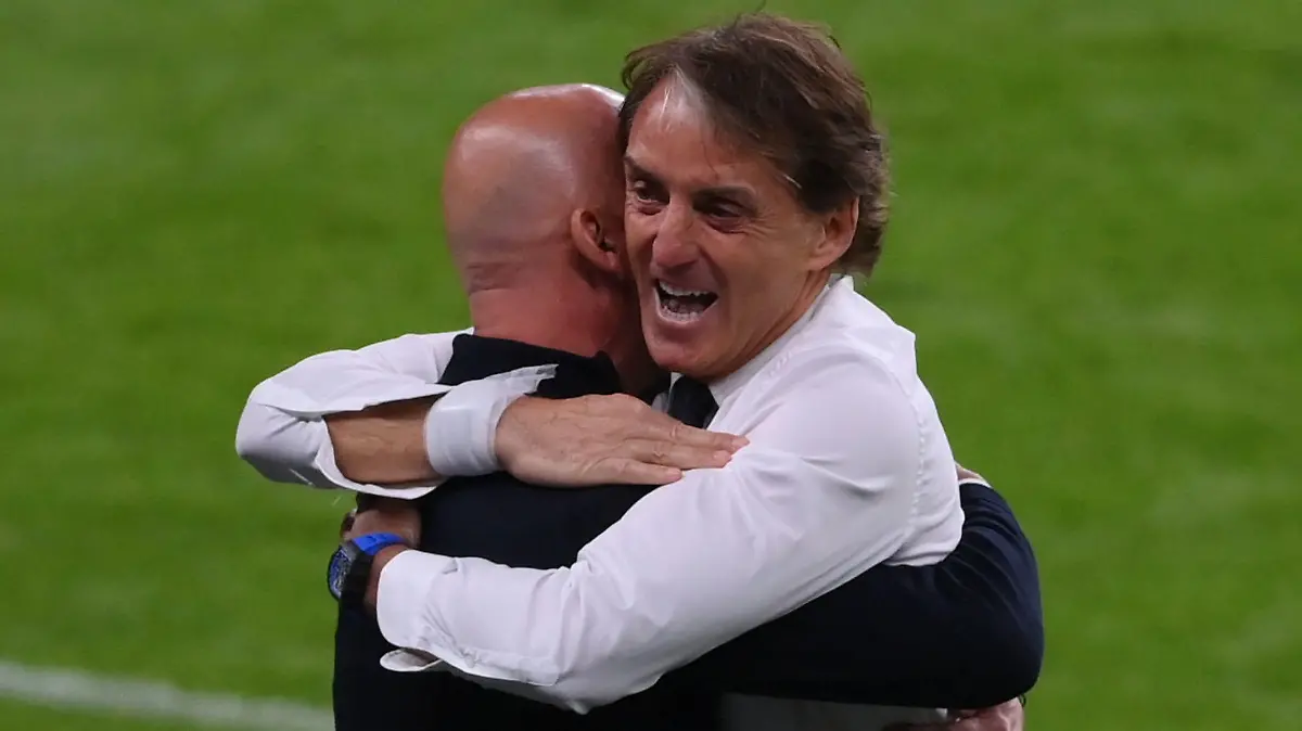 Soccer Football - Euro 2020 - Round of 16 - Italy v Austria - Wembley Stadium, London, Britain - June 26, 2021 Italy coach Roberto Mancini celebrates with delegation chief Gianluca Vialli after Italy's Federico Chiesa scores their first goal Pool via REUTERS/Laurence Griffiths