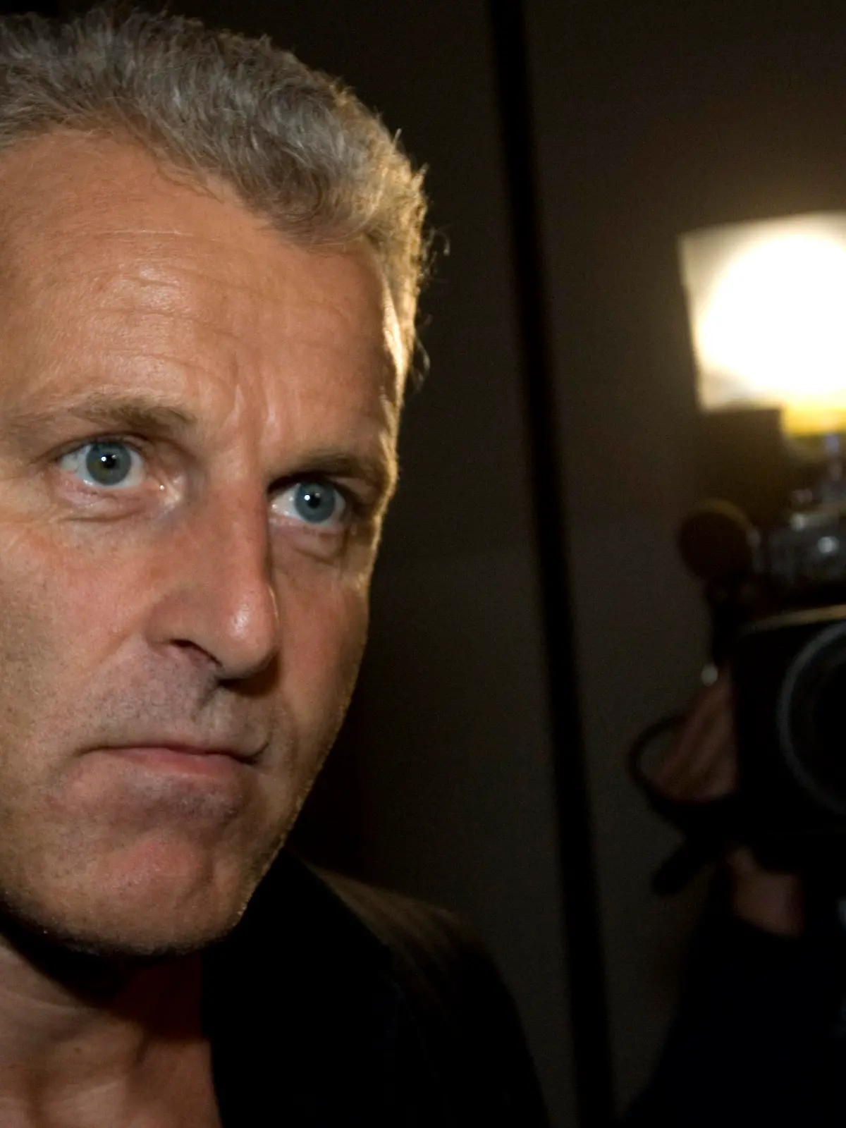 FILE - In this Thursday Jan. 31, 2008 file photo, Dutch crime reporter Peter R. de Vries reacts prior to attending a live TV show in Amsterdam, Netherlands. De Vries, one of the Netherlands best known crime reporters was shot Tuesday evening July 6, 2021, and taken to a hospital with serious injuries, police said.(AP Photo/Peter Dejong, File)