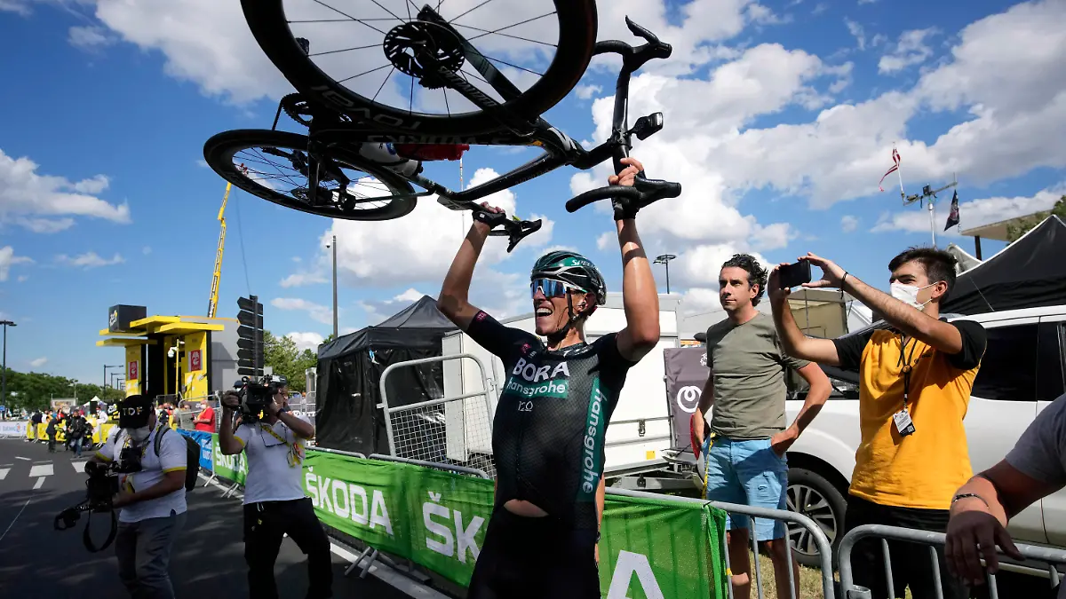 German Nils Politt celebrates after winning the twelfth stage of the Tour de France cycling race over 159.4 kilometers (99 miles) with start in Saint-Paul-Trois-Chateaux and finish in Nimes, France, Thursday, July 8, 2021. (AP Photo/Christophe Ena, Pool)