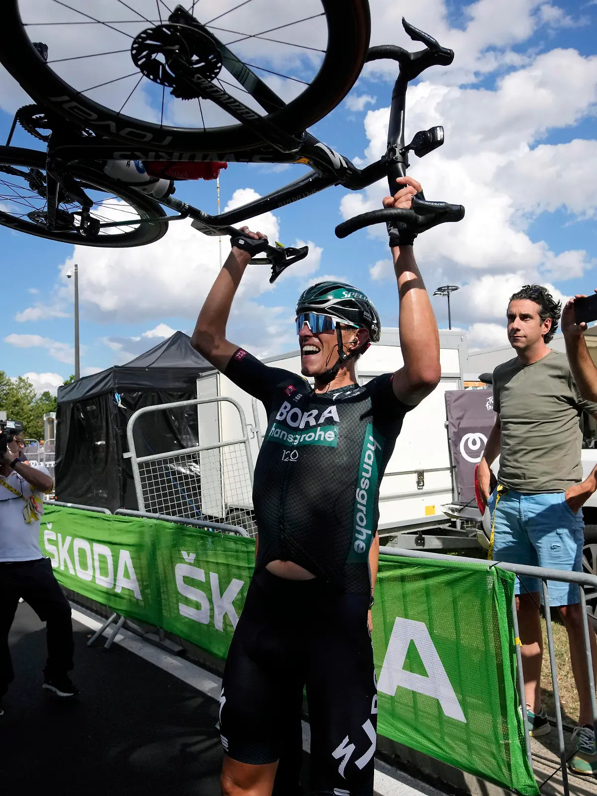 German Nils Politt celebrates after winning the twelfth stage of the Tour de France cycling race over 159.4 kilometers (99 miles) with start in Saint-Paul-Trois-Chateaux and finish in Nimes, France, Thursday, July 8, 2021. (AP Photo/Christophe Ena, Pool)