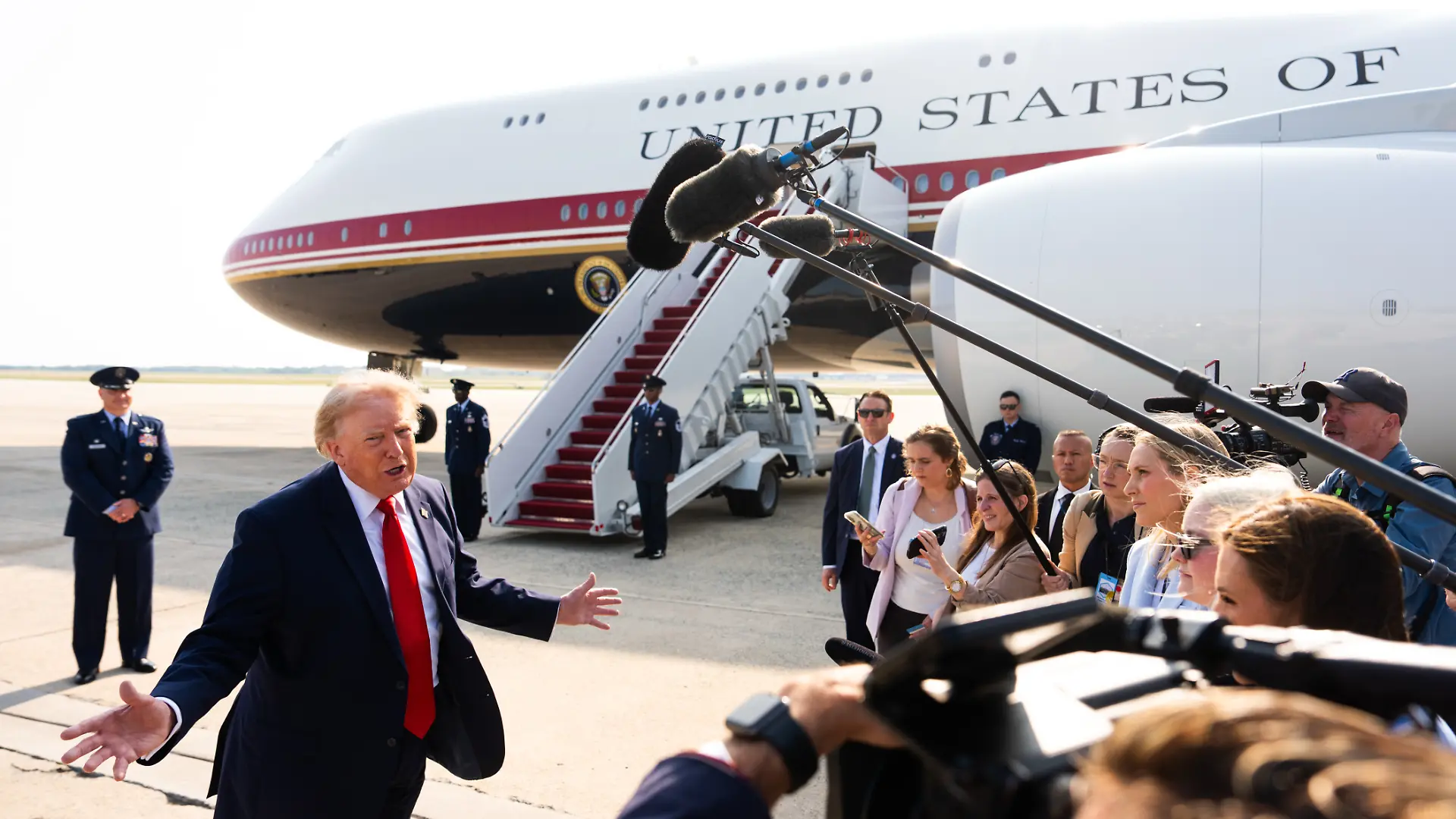 President Donald Trump speaks with reporters before boarding the new Air Force One, Wednesday, July 1, 2026, at Joint Base Andrews, Md. (AP Photo/Julia Demaree Nikhinson)