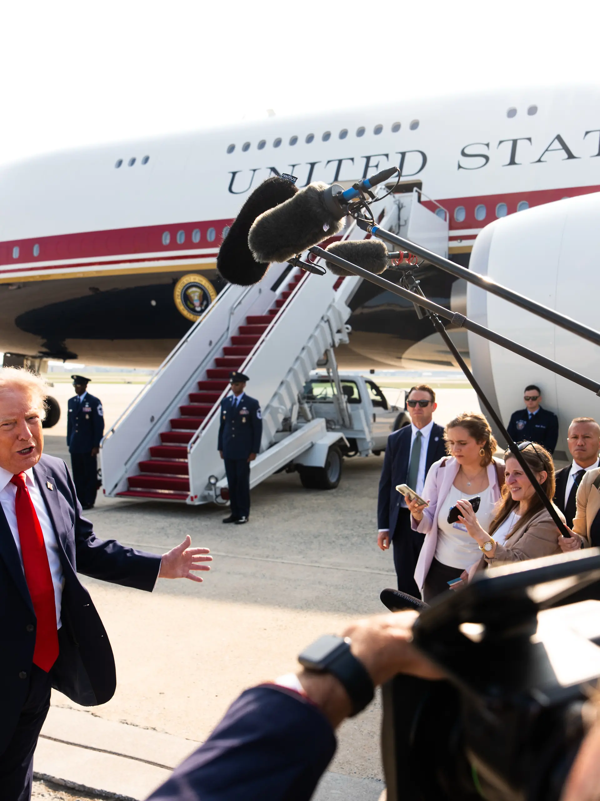 President Donald Trump speaks with reporters before boarding the new Air Force One, Wednesday, July 1, 2026, at Joint Base Andrews, Md. (AP Photo/Julia Demaree Nikhinson)