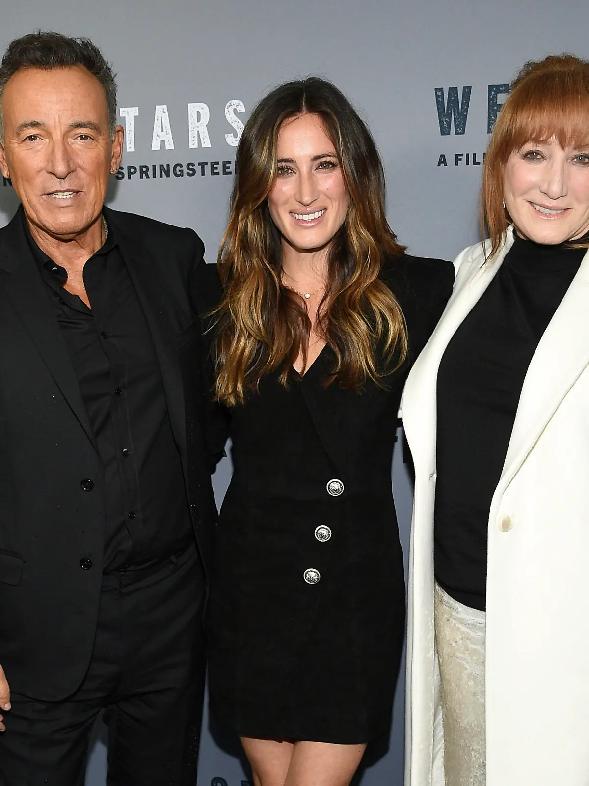 FILE - Singer-songwriter and co-director Bruce Springsteen, left, daughter Jessica Springsteen, center, and wife Patti Scialfa attend the special screening of "Western Stars" at Metrograph in New York, in this Wednesday, Oct. 16, 2019, file photo. The daughter of rock icon Bruce Springsteen and singer-songwriter Patti Scialfa has been selected as one of four riders on the U.S. jumping team that will compete at the Tokyo Olympics. Twenty-nine-year-old Jessica Springsteen is making her Olympic debut.(Photo by Evan Agostini/Invision/AP, File)