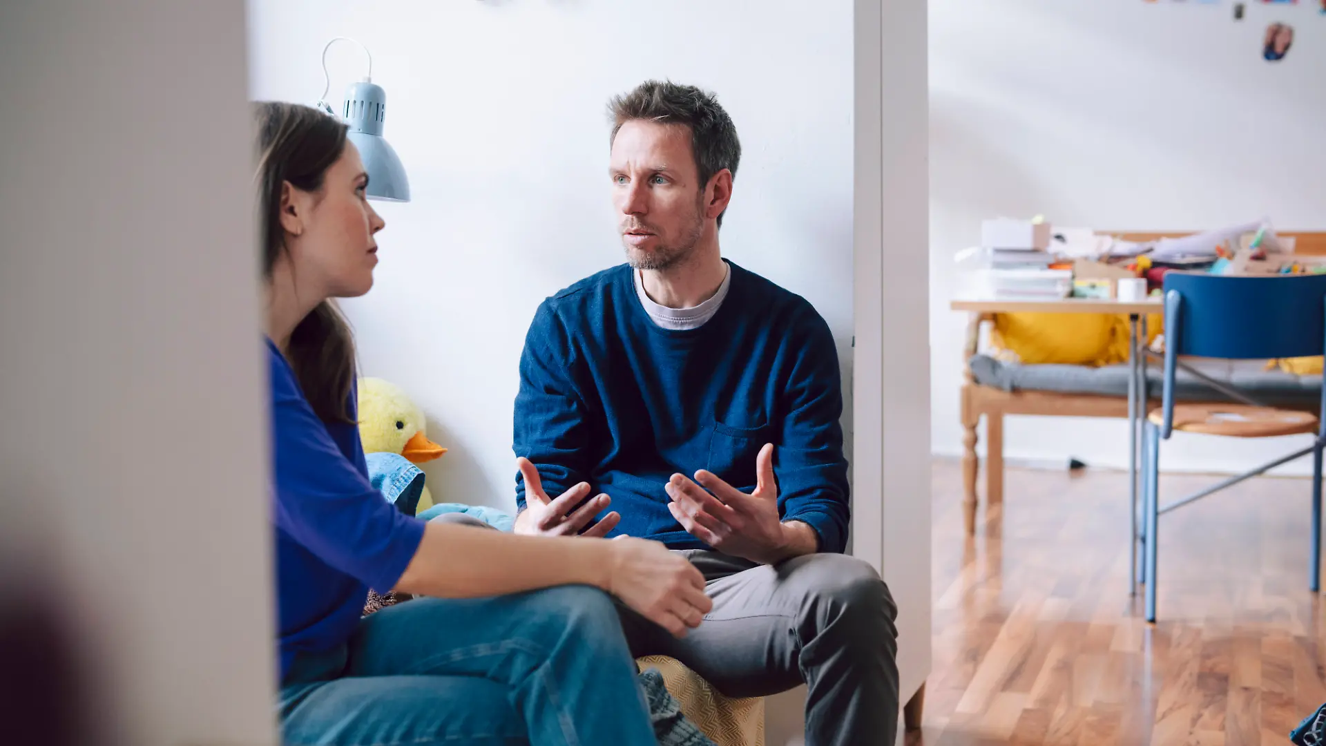 Couple having a serious conversation at home in the living room model released, Symbolfoto property released, KNSF11203