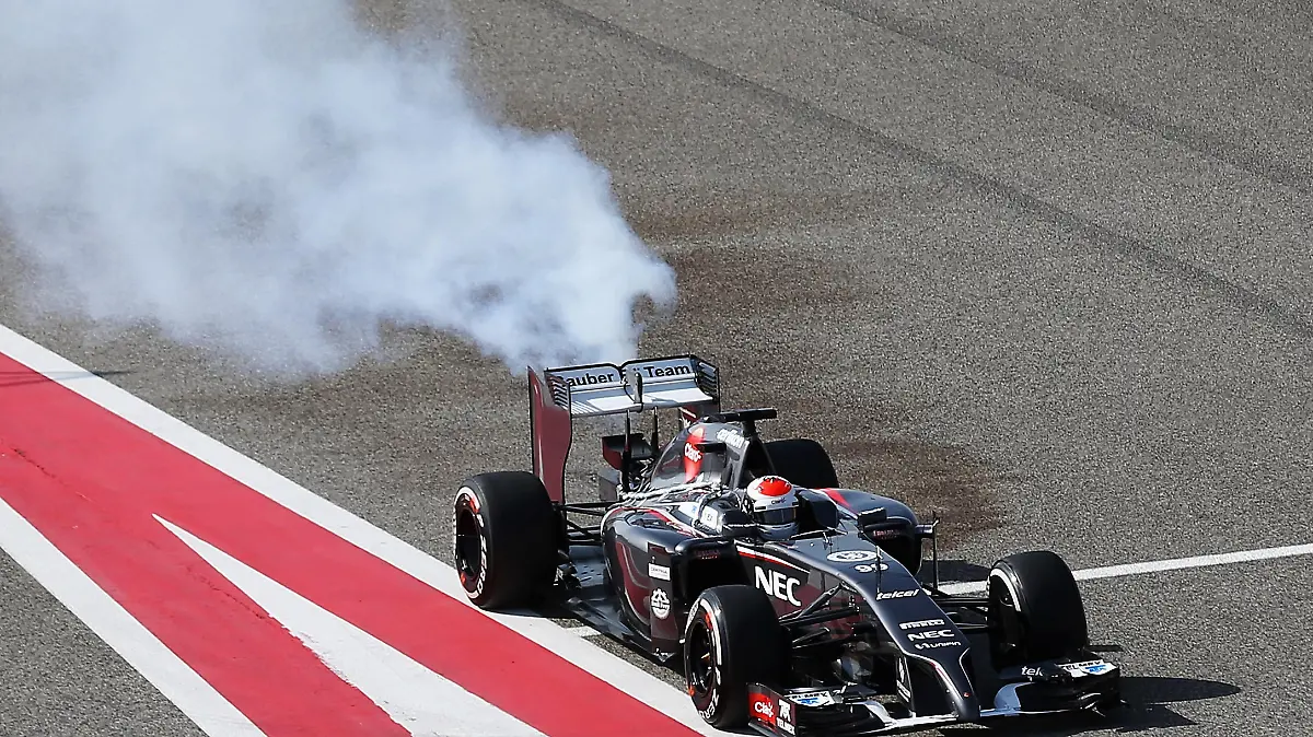 BAHRAIN, BAHRAIN - MARCH 01: Adrian Sutil of Germany and Sauber F1 pulls into the pitlane with an engine fire during day three of Formula One Winter Testing at the Bahrain International Circuit on March 1, 2014 in Bahrain, Bahrain. (Photo by Mark Thompson/Getty Images)