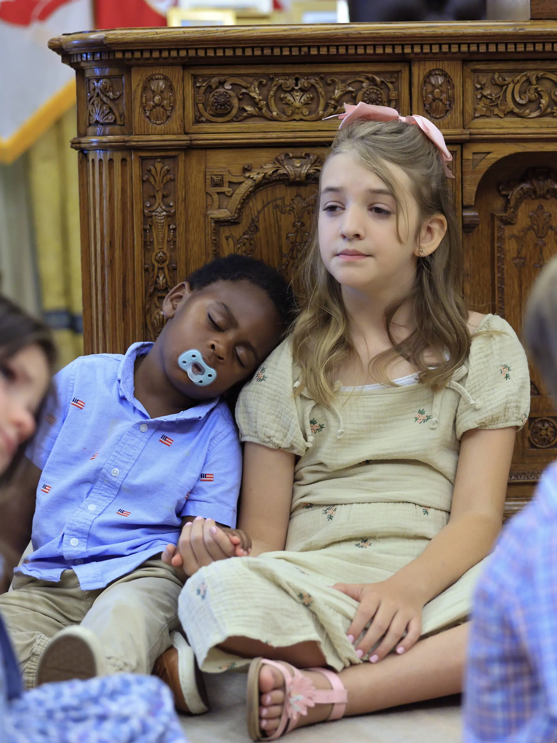 Children sit on the floor as US President Donald J. Trump not pictured speaks on the first day of trading for Trump Accounts in the Oval Office of the White House in Washington, DC, USA, 06 July 2026. Trump Accounts grant eligible US children born between 2026 and 2028 $1000.00 to fund starter IRAs. Copyright: 