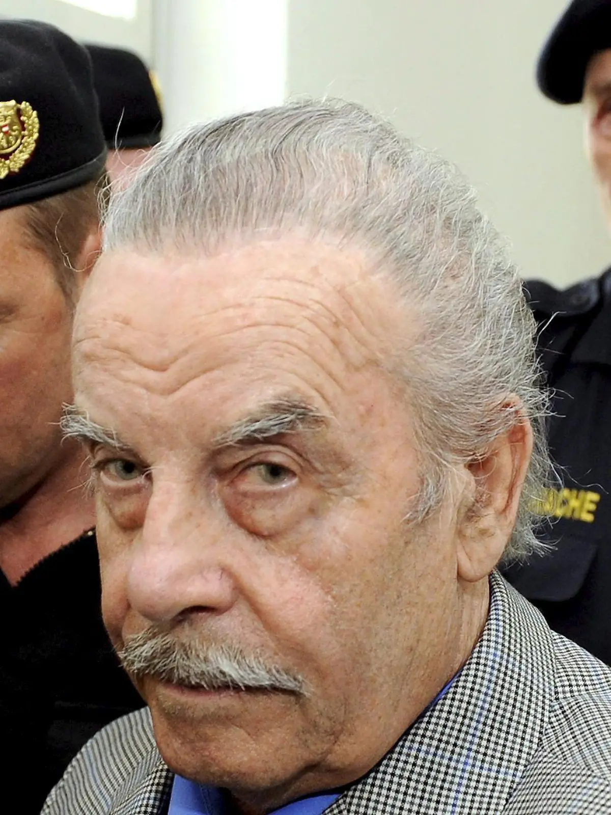 Defendant Josef F. (C), prior to the start of the fourth day of his trial for incest on 19 March 2009, at the provincial courthouse in St. Poelten. Josef F., the Austrian father on trial for imprisoning and raping his daughter Elisabeth for 24 years in the cellar of his home, pleaded guilty to murder 18 March 2009. An Austrian prosecutor is urging a jury to hand down a life sentence to Josef F., who imprisoned his daughter in a windowless cell for 24 years and fathered her seven children. Prosecutor Christiane Burkheiser called for the maximum punishment in her closing arguments in Josef F.'s trial in St. Poelten. COURT IMPOSED RESTRICTIONS APPLY: These photographs are being licensed free of charge for editorial use by media representatives covering the ongoing criminal trial. All other uses, including resale of the photographs, are strictly prohibited. The user takes sole responsibility for protecting the image and identity rights of those pictured, by pixellation or other means. EPA/ROBERT JAEGER / POOL NO SALES - EDITORIAL USE ONLY  +++(c) dpa - Bildfunk+++