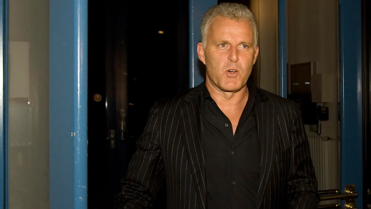 FILE - In this Thursday Jan. 31, 2008 file photo, Dutch crime reporter Peter R. de Vries arrives for a live TV show in Amsterdam, Netherlands. De Vries, one of the Netherlands best known crime reporters was shot Tuesday evening July 6, 2021, and taken to a hospital with serious injuries, police said.(AP Photo/Peter Dejong, File)