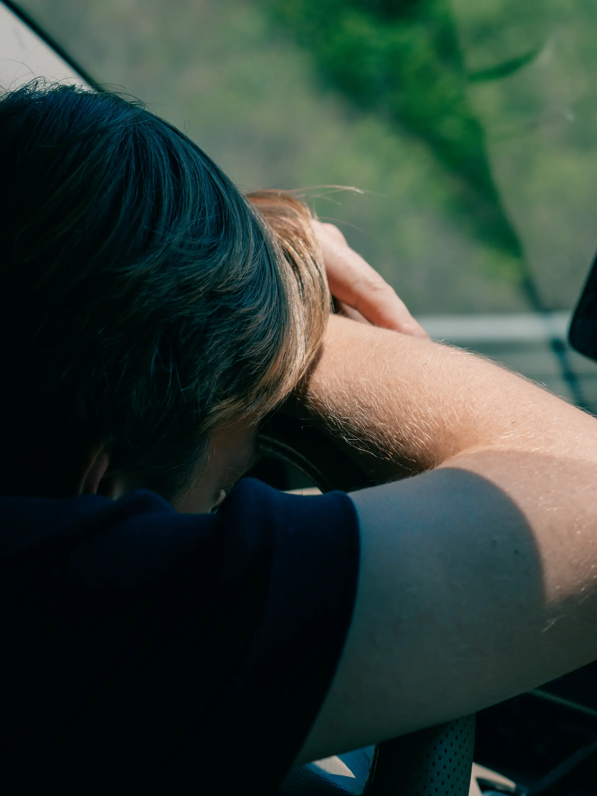 the driver was tired and leaned on the steering wheel. High quality photo xkwx asleep auto bored car danger drive driver highway people person rest road safety sitting sleep sleepy steering stress tired traffic transportation travel vehicle annoyed asian attention depressed depression desire driver fatigue exhausted fall asleep head headache incident indian lazy man motor nap napping problem risk seat stop stressed way worried young
