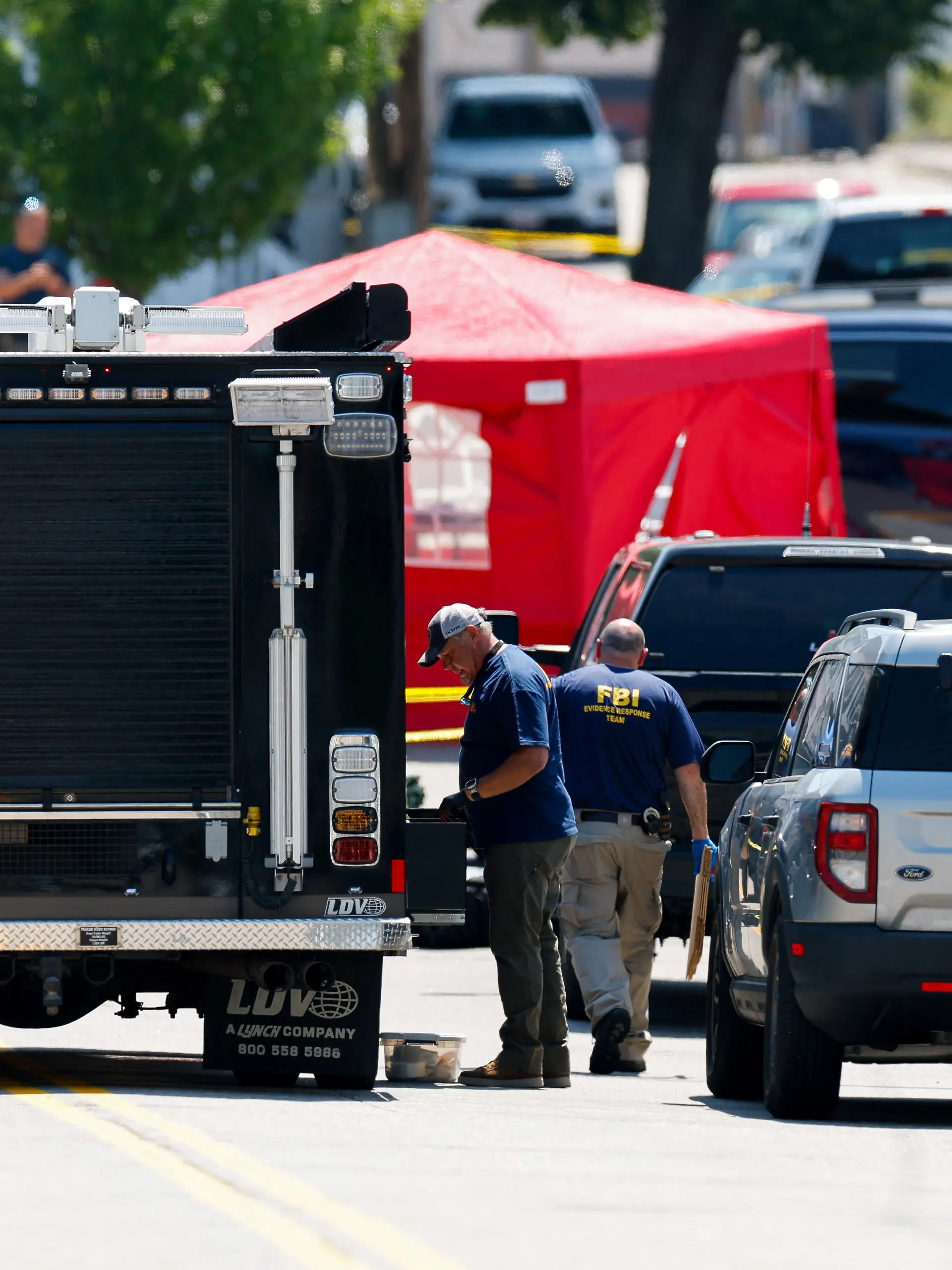 FBI agents work at a scene of a shooting involving U.S. Immigration and Customs Enforcement (ICE) in Biddeford, Maine, U.S. July 13, 2026.  REUTERS/CJ Gunther
