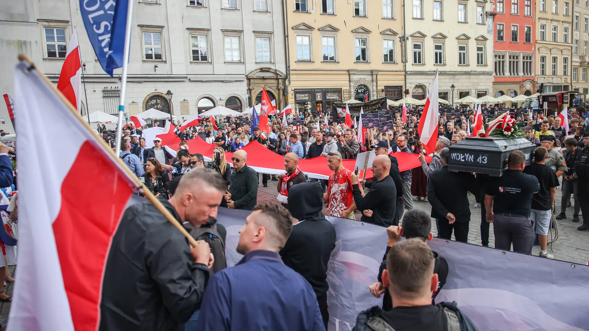 People hold flags while attending 'Volhynia March' commemorating Polish victims of Ukrainian genocide commited in Volhynia and Eastern Galicia during the Second World War. Krakow, Poland on July 5th, 2026. The massacres of Poles were carried out in German-occupied Poland from 1943 to 1945 by the Ukrainian Insurgent Army, or the UPA, with the support of parts of the local Ukrainian population. Most of the victims were women and children. The UPA's actions resulted in between 50,000 and 100,000 deaths. Recently, Polish President Karol Nawrocki stripped Ukraine's President Volodymyr Zelenskyy of the Order of the White Eagle because Zelenskyy named a Ukrainian military unit 'Heroes of the UPA'. (Photo by Beata Zawrzel/NurPhoto)