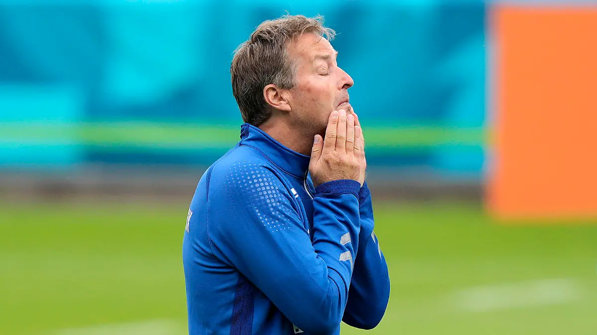 Denmark's manager Kasper Hjulmand, left, reacts at the training ground during a training session of Denmark's national team in Helsingor, Denmark, Monday, June 14, 2021. It is the first training of the Danish team since the Euro championship soccer match against Finland when Christian Eriksen collapsed last Saturday. (AP Photo/Martin Meissner)