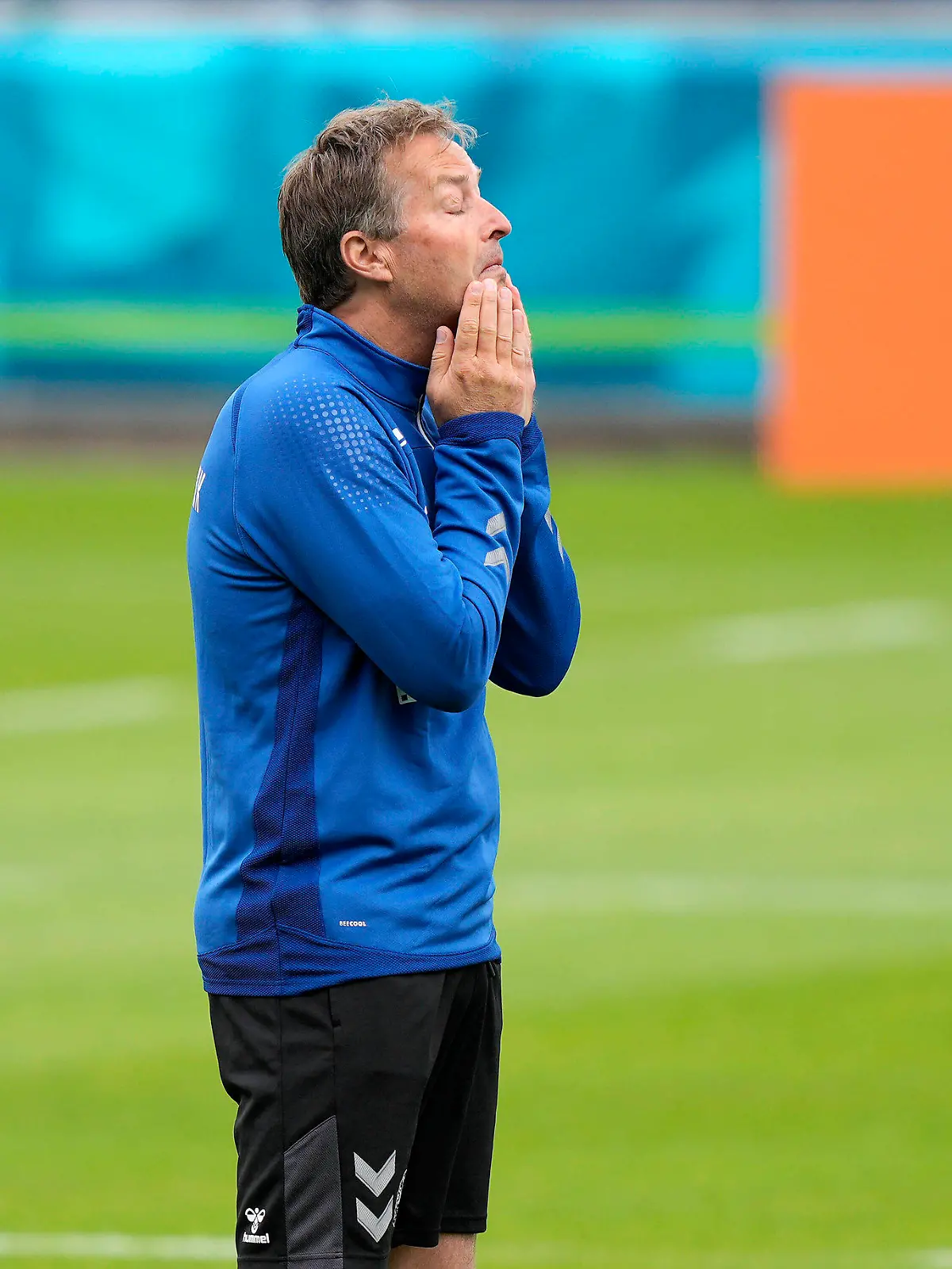 Denmark's manager Kasper Hjulmand, left, reacts at the training ground during a training session of Denmark's national team in Helsingor, Denmark, Monday, June 14, 2021. It is the first training of the Danish team since the Euro championship soccer match against Finland when Christian Eriksen collapsed last Saturday. (AP Photo/Martin Meissner)