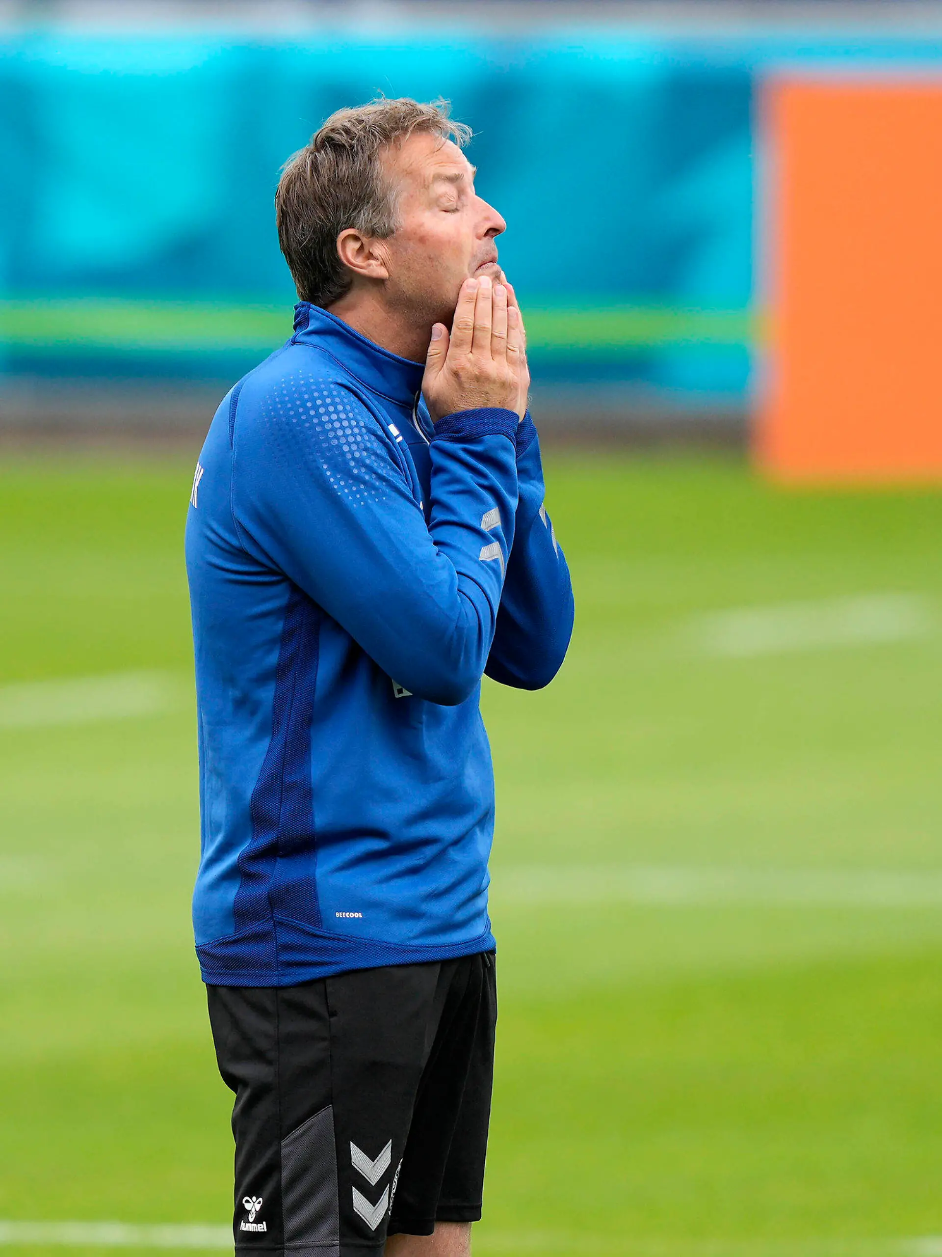 Denmark's manager Kasper Hjulmand, left, reacts at the training ground during a training session of Denmark's national team in Helsingor, Denmark, Monday, June 14, 2021. It is the first training of the Danish team since the Euro championship soccer match against Finland when Christian Eriksen collapsed last Saturday. (AP Photo/Martin Meissner)