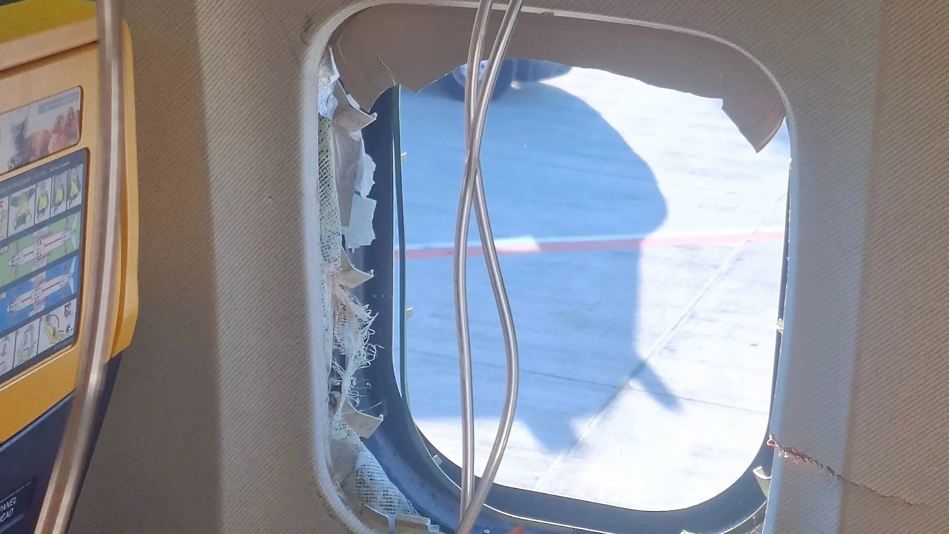 A broken window of the Ryanair aircraft, following a reported emergency landing, in location given as Thessaloniki, Greece, July 10, 2026, in this picture obtained from social media. Despoina Papapavlou/via REUTERS THIS IMAGE HAS BEEN SUPPLIED BY A THIRD PARTY. MANDATORY CREDIT. VERIFICATION LINES: - The interior of the cabin, including the seats and windows, matched archive images of a Ryanair Boeing 737 - The broken window matches Reuters reporting about a passenger who was partially sucked through a dislodged window on a Ryanair Boeing 737 flight on July 10 - Corroborating visuals from local media match the shape and cracks of the broken window - Date confirmed by original file metadata