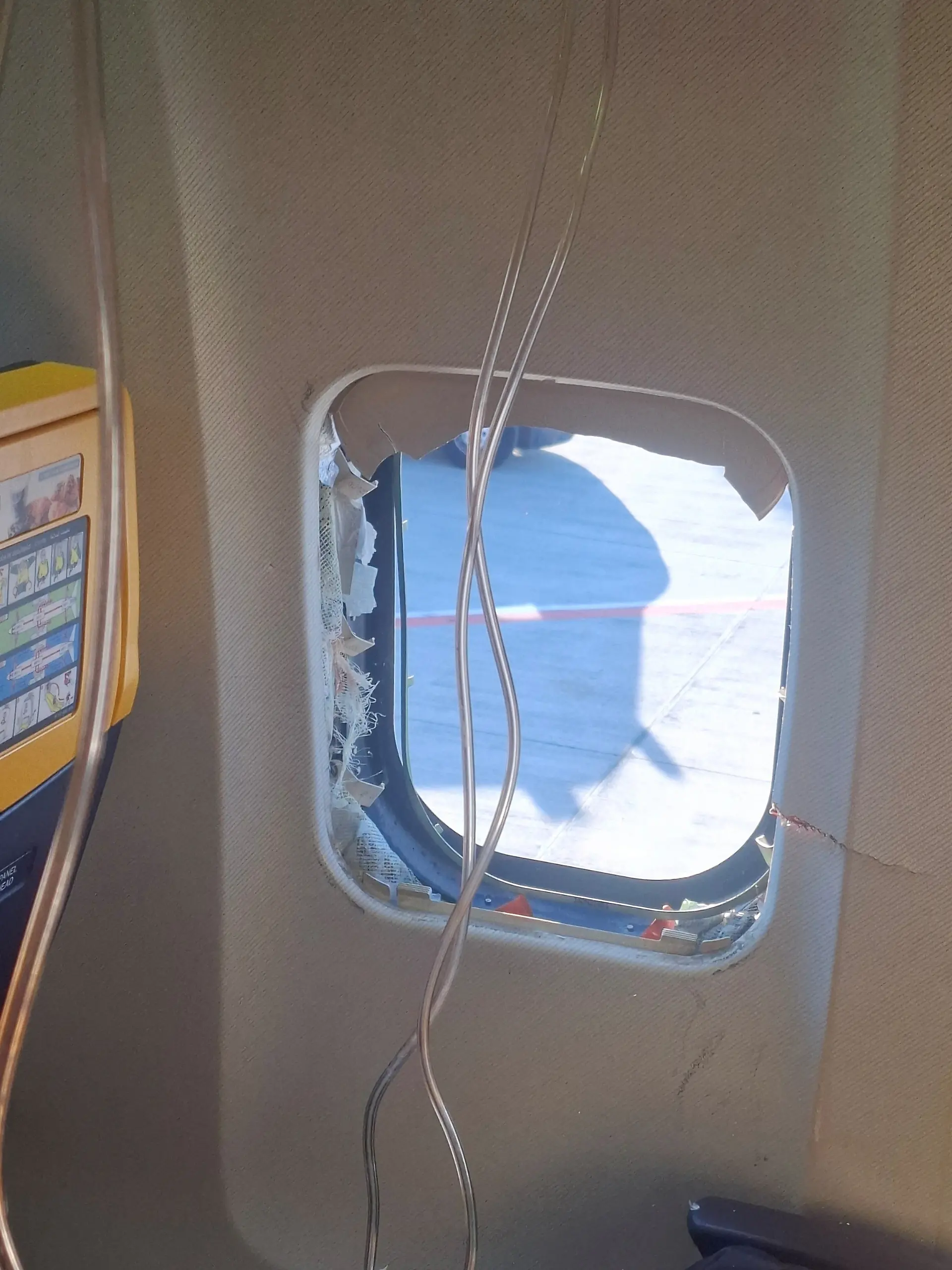 A broken window of the Ryanair aircraft, following a reported emergency landing, in location given as Thessaloniki, Greece, July 10, 2026, in this picture obtained from social media. Despoina Papapavlou/via REUTERS THIS IMAGE HAS BEEN SUPPLIED BY A THIRD PARTY. MANDATORY CREDIT. VERIFICATION LINES: - The interior of the cabin, including the seats and windows, matched archive images of a Ryanair Boeing 737 - The broken window matches Reuters reporting about a passenger who was partially sucked through a dislodged window on a Ryanair Boeing 737 flight on July 10 - Corroborating visuals from local media match the shape and cracks of the broken window - Date confirmed by original file metadata