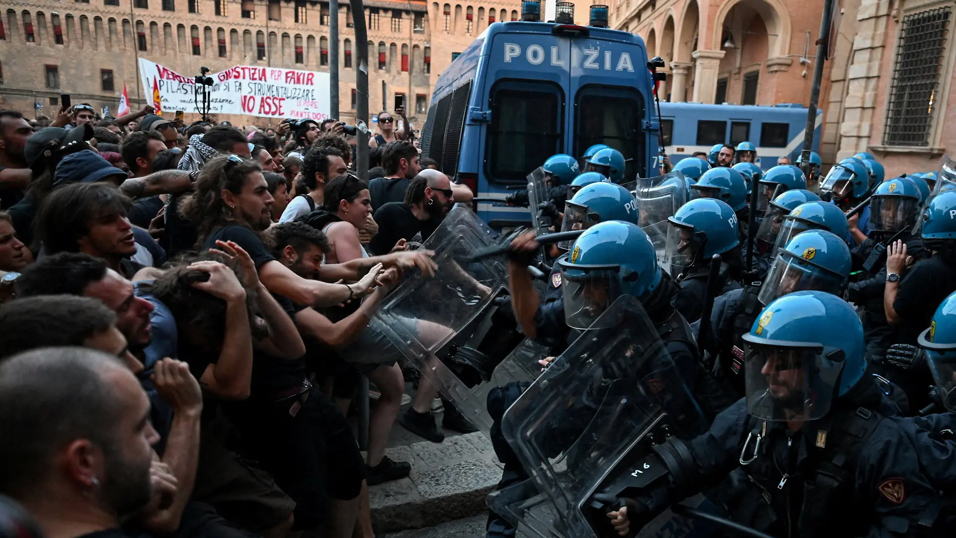 Protesters clash with riot police during a protest following the death of Abderrahim Fakir after he was restrained by police during an attempted detention, in Bologna, Italy, July 20, 2026. REUTERS/Michele Lapini TPX IMAGES OF THE DAY