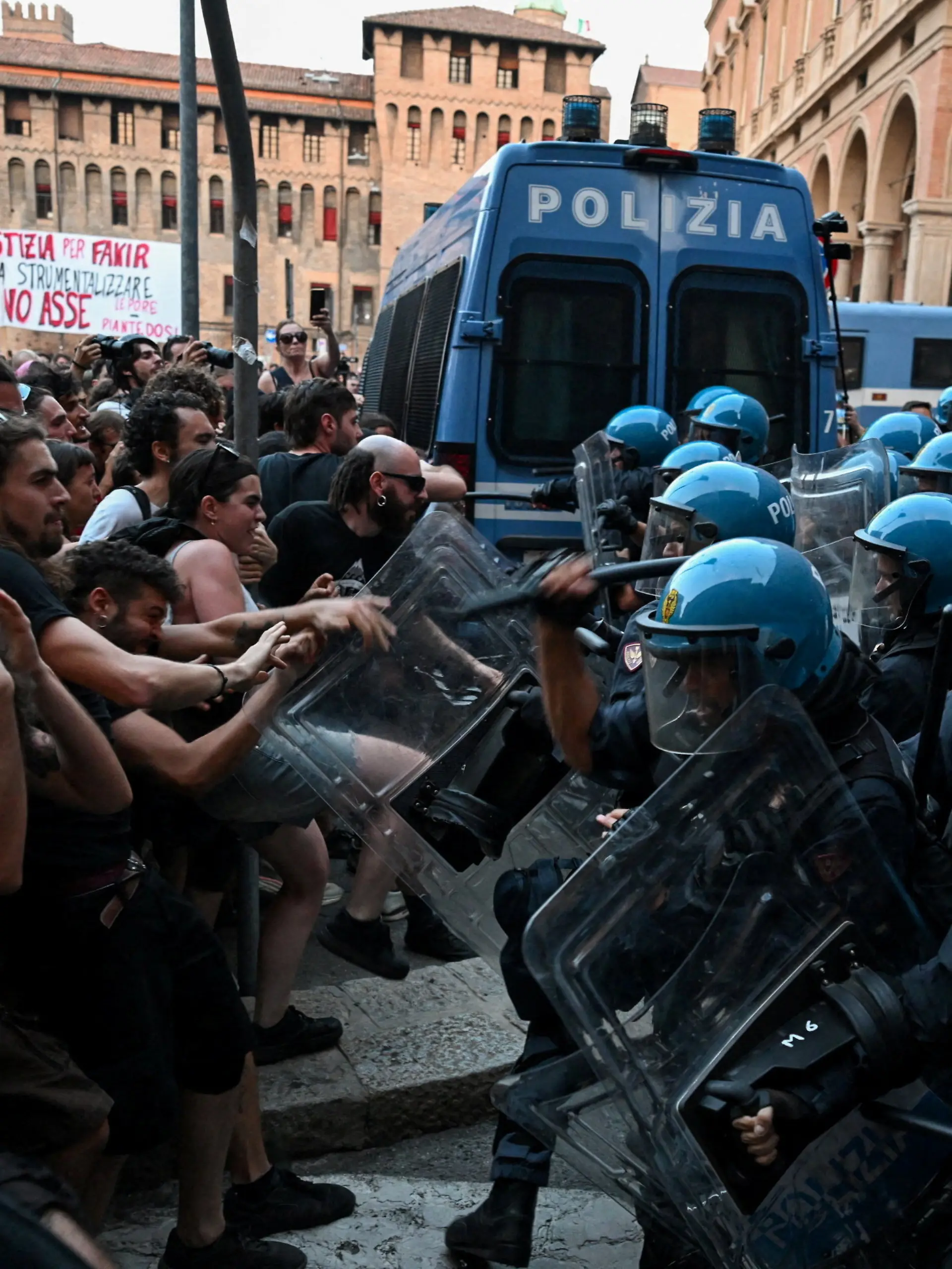 Protesters clash with riot police during a protest following the death of Abderrahim Fakir after he was restrained by police during an attempted detention, in Bologna, Italy, July 20, 2026. REUTERS/Michele Lapini TPX IMAGES OF THE DAY