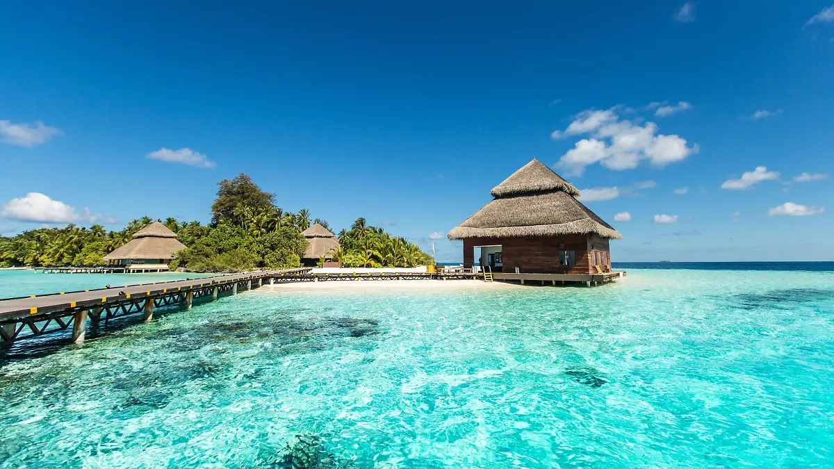 small tropical island with beach villas