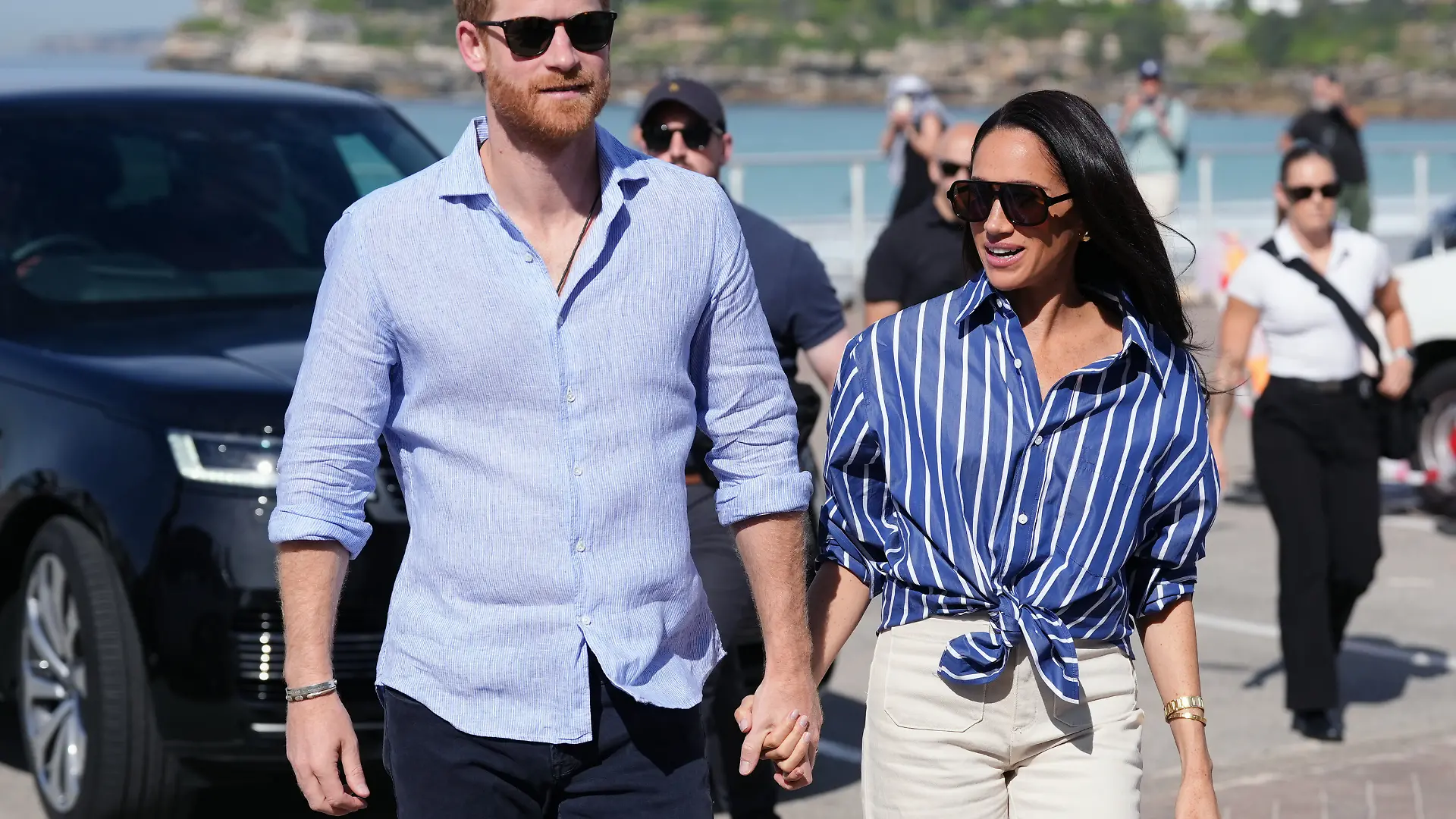 Prince Harry, and Meghan, the Duke and Duchess of Sussex, arrive to meet volunteer first responders from Bondi Surf Bathers' Life Saving Club, during a visit to Bondi Beach, Australia, Friday, April 17, 2026. (Jonathan Brady/Pool Photo via AP)