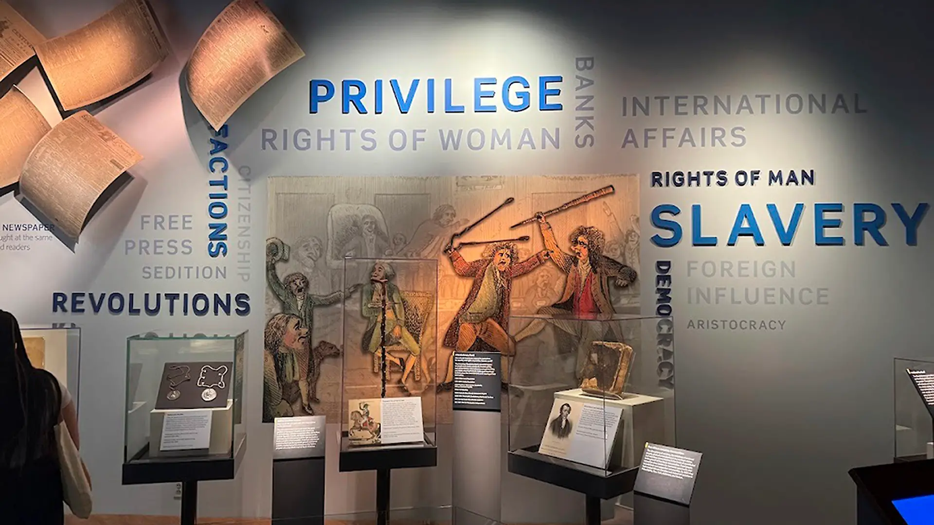This wall in the “Great Debate” section of a democracy exhibit at the National Museum of American History, shown Aug. 26, 2025, in Washington, reflects some of the issues the nation grapples with. President Donald Trump is pressing for changes in the stories the Smithsonian museums tell about America. He wants U.S. history cast in a more positive light. (AP Photo/Calvin Woodward)