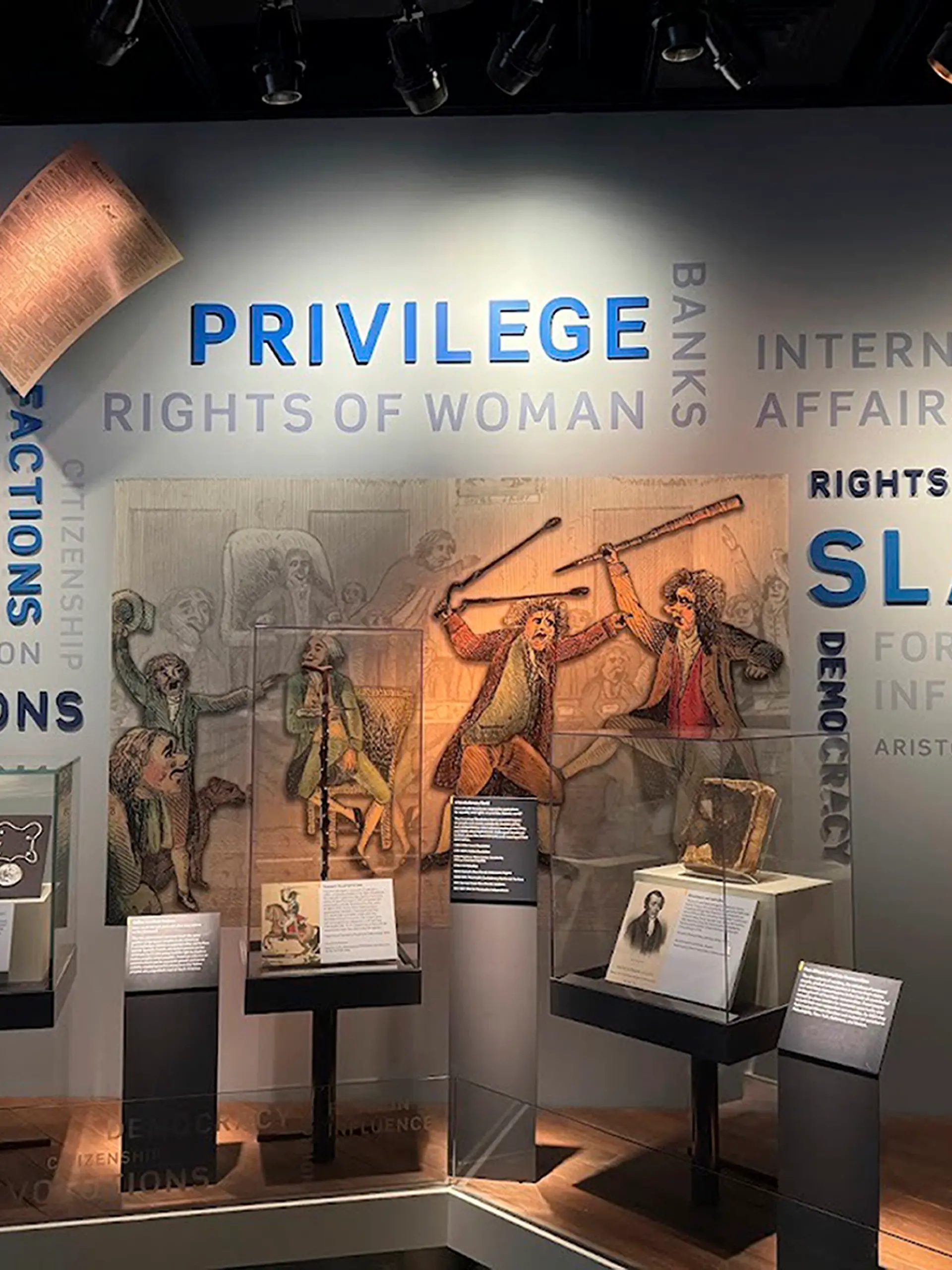 This wall in the “Great Debate” section of a democracy exhibit at the National Museum of American History, shown Aug. 26, 2025, in Washington, reflects some of the issues the nation grapples with. President Donald Trump is pressing for changes in the stories the Smithsonian museums tell about America. He wants U.S. history cast in a more positive light. (AP Photo/Calvin Woodward)
