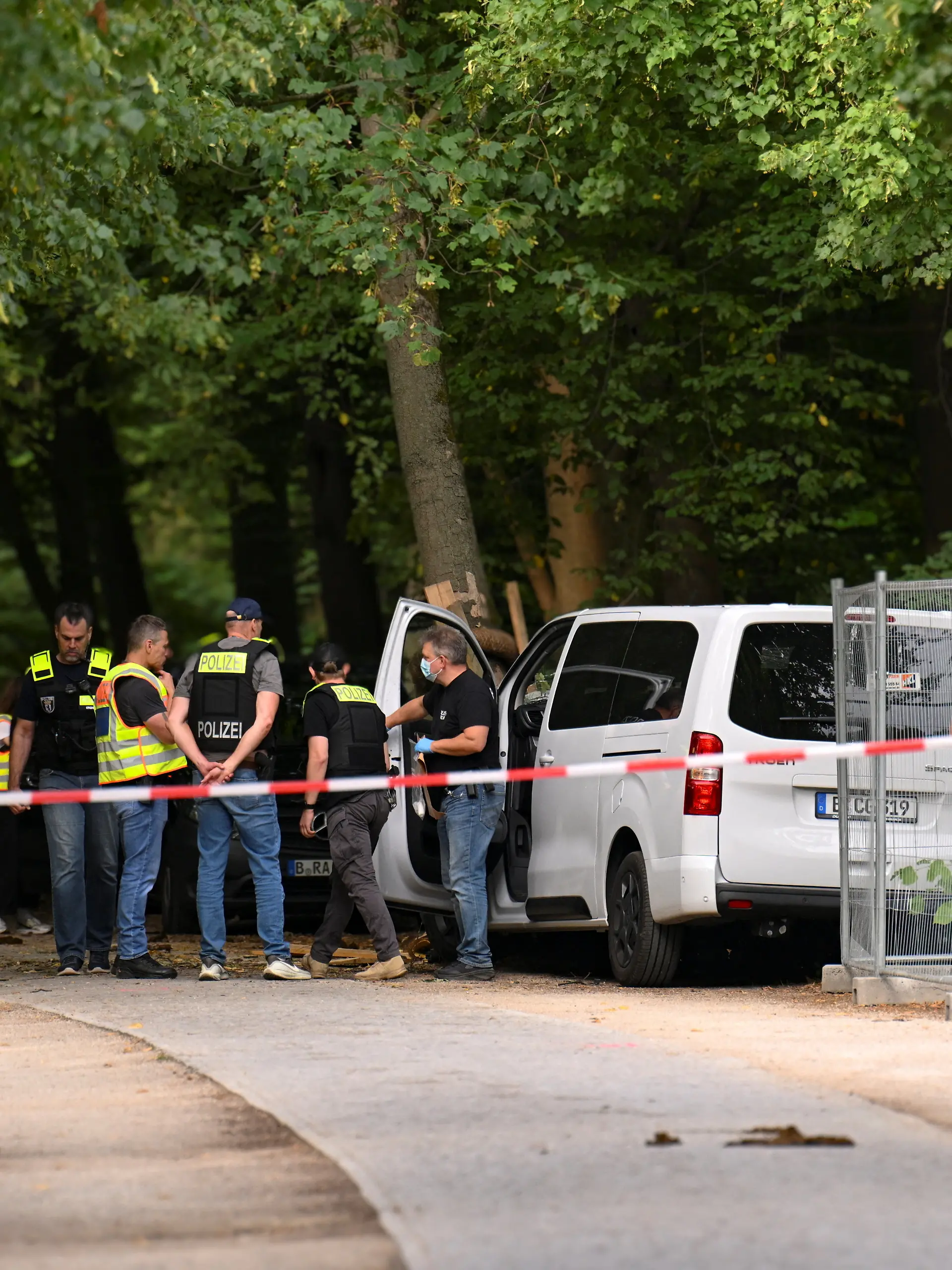 Police inspect a vehicle which crashed into a crowd near Berlin's annual Christopher Street Day Pride parade on Saturday evening, leaving multiple people injured and the parade called off, in Berlin, Germany, July 26, 2026. REUTERS/Annegret Hilse
