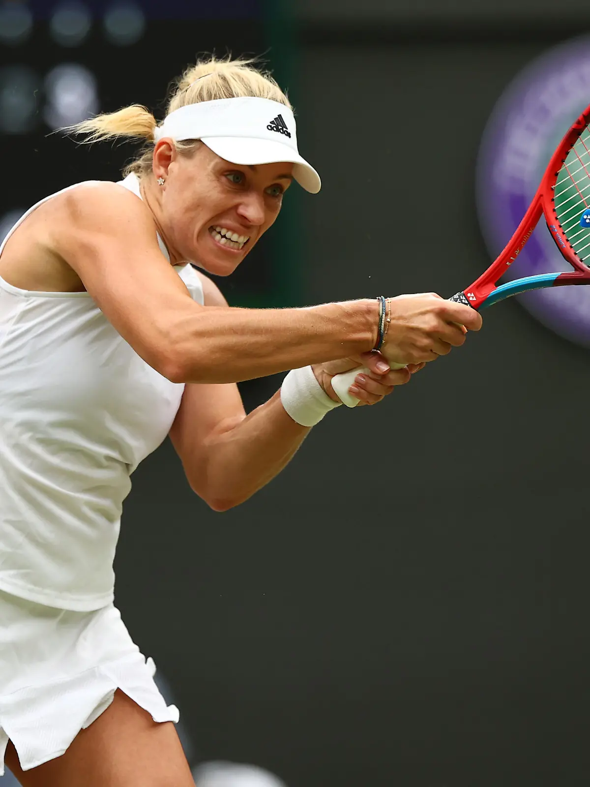 LONDON, ENGLAND - JULY 06: Angelique Kerber of Germany plays a backhand in her Ladies' Singles Quarter-Final match against  Karolina Muchova of The Czech Republic during Day Eight of The Championships - Wimbledon 2021 at All England Lawn Tennis and Croquet Club on July 06, 2021 in London, England. (Photo by Julian Finney/Getty Images)