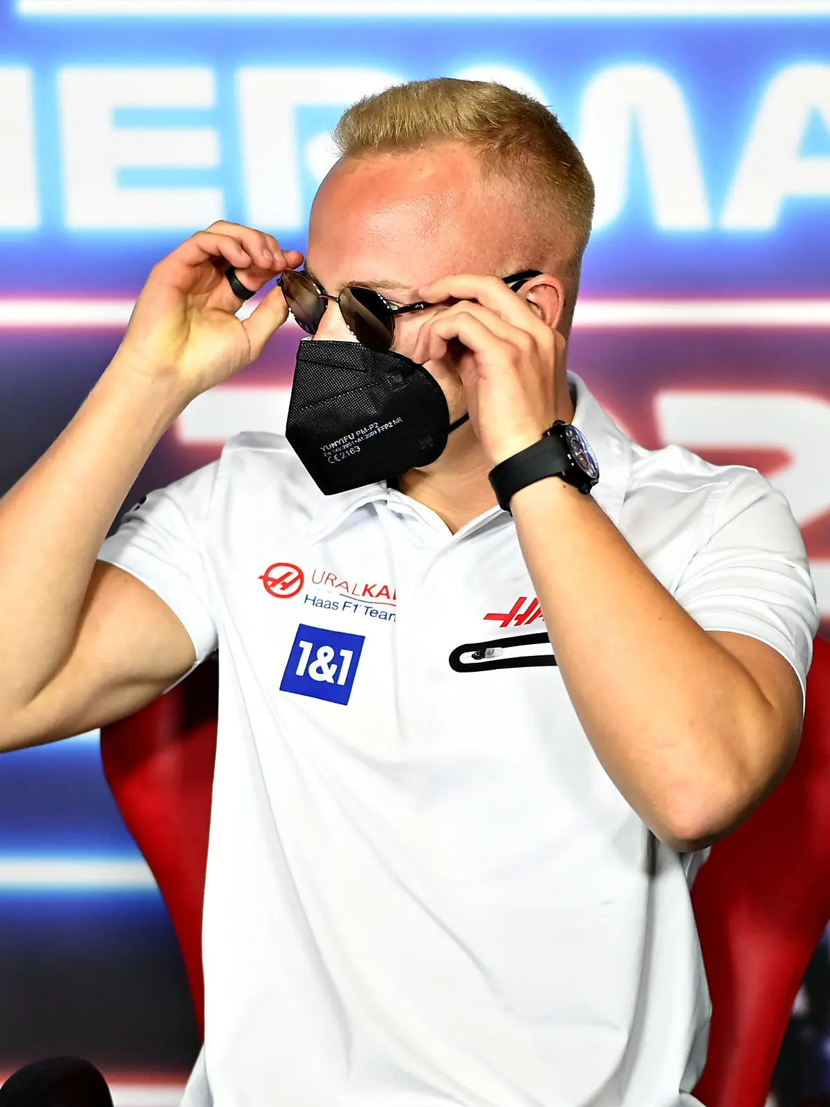 SPIELBERG, AUSTRIA - JUNE 24: Nikita Mazepin of Russia and Haas F1 puts on his sunglasses in the Drivers Press Conference during previews ahead of the F1 Grand Prix of Styria at Red Bull Ring on June 24, 2021 in Spielberg, Austria. (Photo by Christian Bruna - Pool/Getty Images)