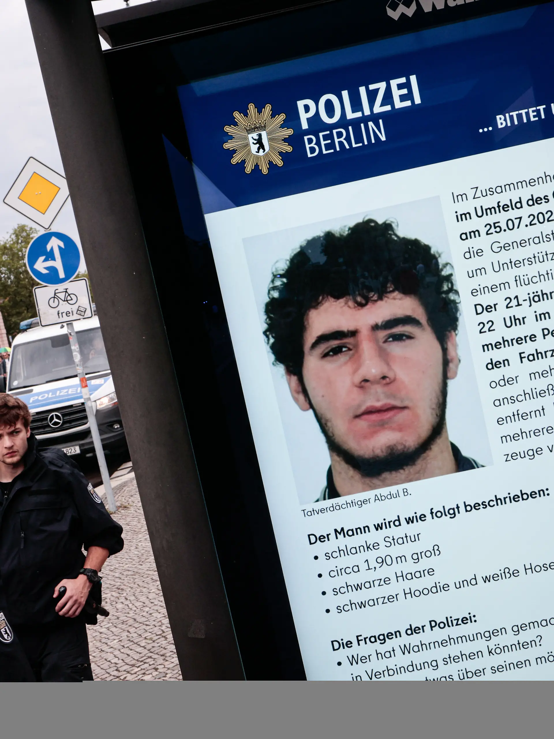 July 26, 2026, Berlin, Germany: A public information screen displays a Berlin police appeal for information about Abdul Ballout, the suspected attacker in the car attack near the CSD Pride parade. On the evening of July 25, a car drove into people in Tiergarten park, killing one person and injuring 29 others. Authorities are searching for the suspected attacker. (Credit Image: © Vasily Krestyaninov/SOPA Images via ZUMA Press Wire